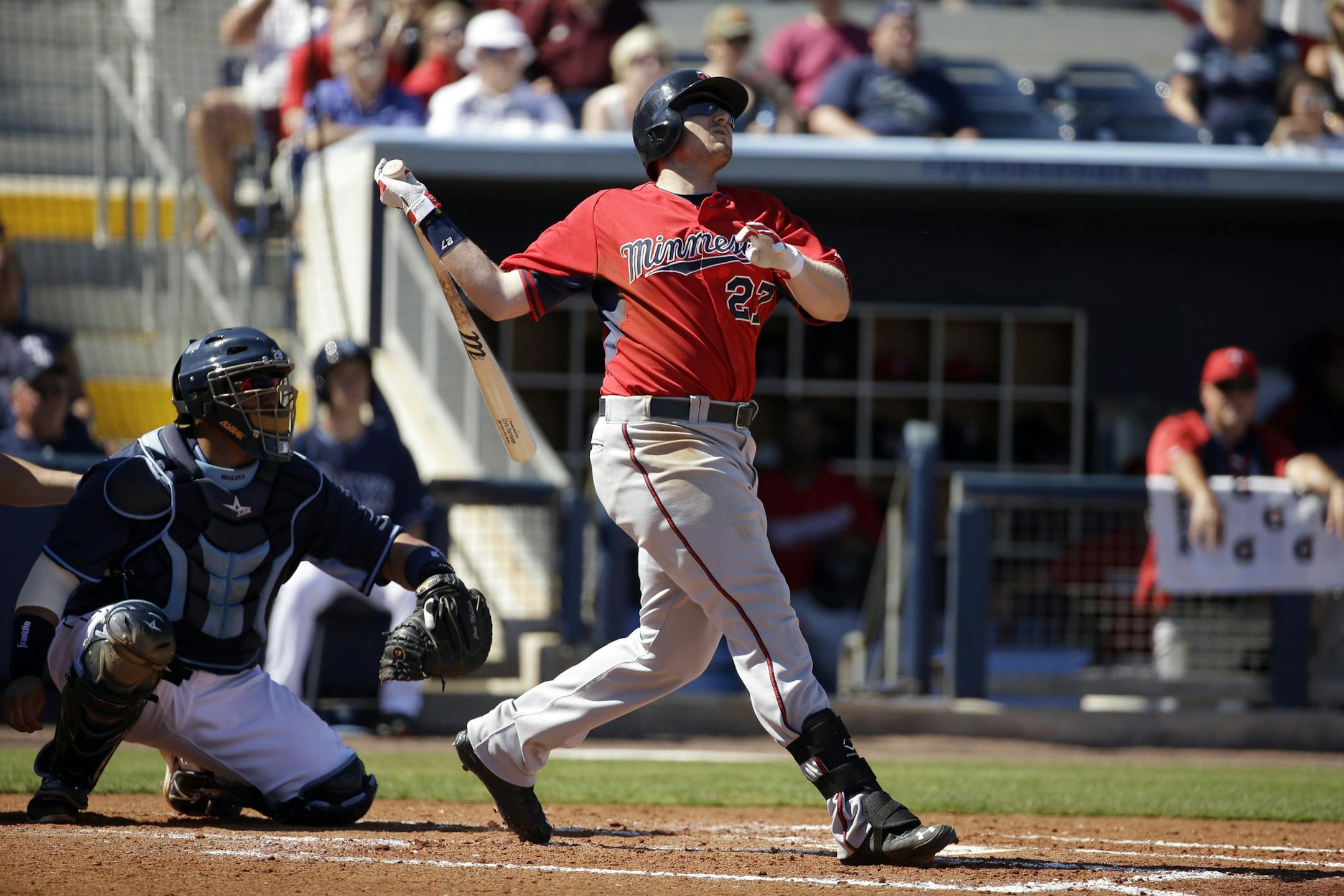 Minnesota Twins' Chris Parmelee follows through on a swing during his at bat in the fourth inning of an exhibition baseball game against the Tampa Bay Rays, Sunday, March 2, 2014, in Port Charlotte, Fla. (AP Photo/Steven Senne)