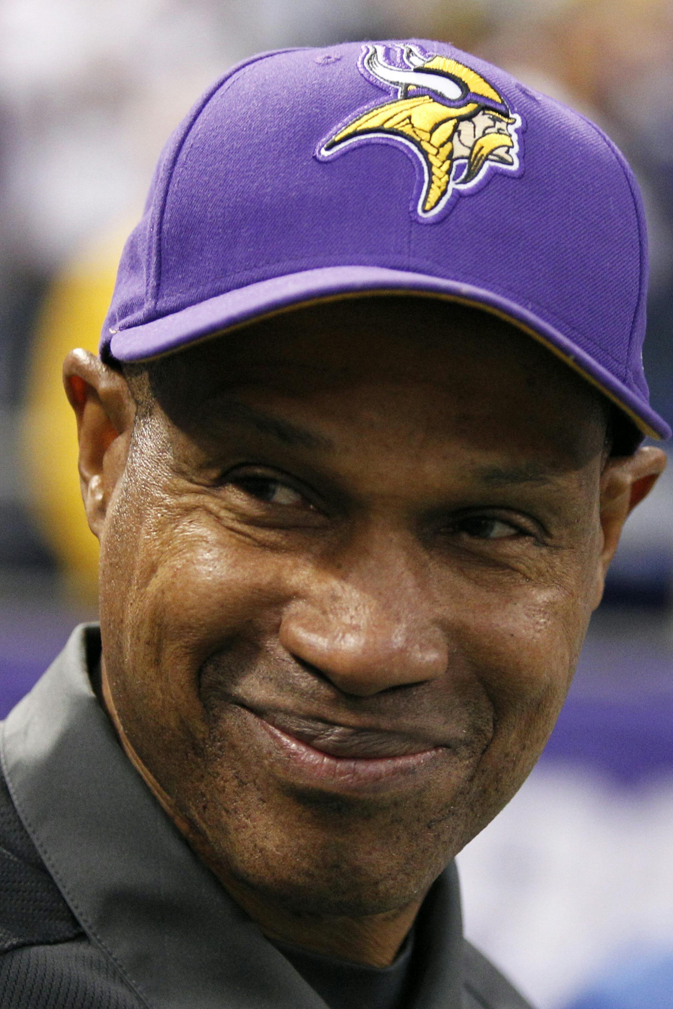 FILE - In this Dec. 30, 2012, file photo Minnesota Vikings head coach Leslie Frazier smiles as he walks onto the field before an NFL football game against the Green Bay Packers in Minneapolis. The Vikings and Frazier have reach agreement on a multi-year contract extension, two people with knowledge of the deal told The Associated Press on Wednesday, Jan. 13, 2013. Both spoke on condition of anonymity because the deal has not been announced and terms were not immediately known. (AP Photo/Geneviev