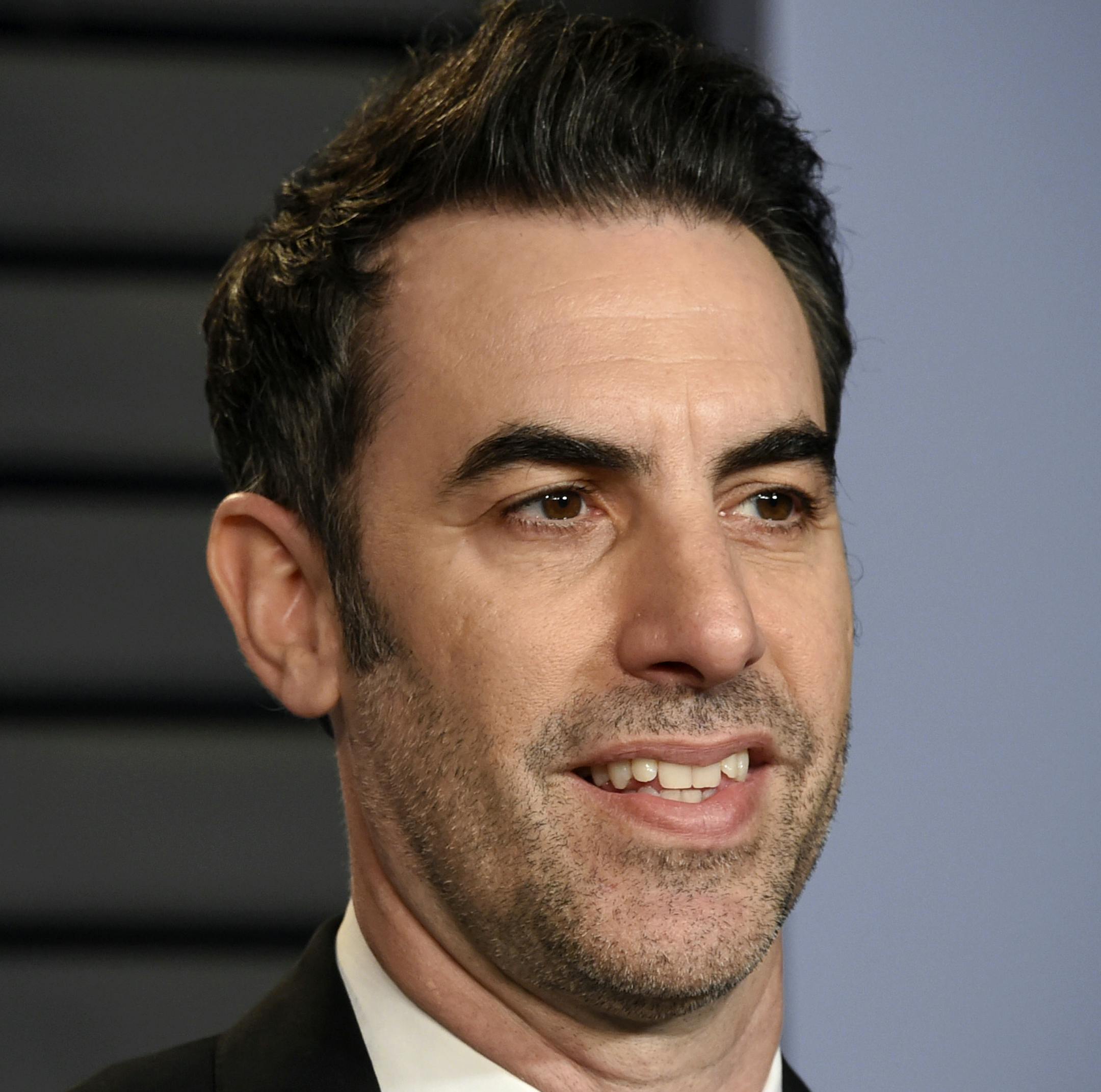 FILE - In this March 4, 2018 file photo, Sacha Baron Cohen arrives at the Vanity Fair Oscar Party in Beverly Hills, Calif. Cohen stars in the new Showtime series "Who Is America?", premiering on Sunday, July 15. (Photo by Evan Agostini/Invision/AP, File)