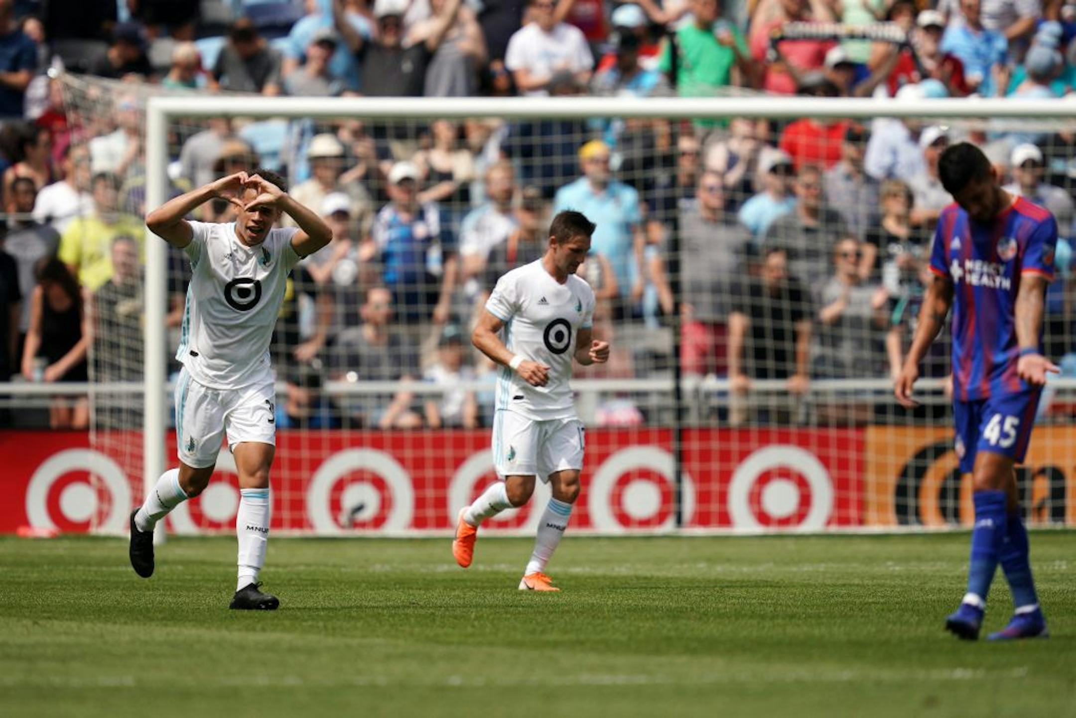 Minnesota United midfielder Hassani Dotson (31) made a heart for fans after he scored in the first half.