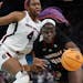South Carolina star Aliyah Boston was a force on offense and defense Friday, including this moment against Louisville’s Olivia Cochran.