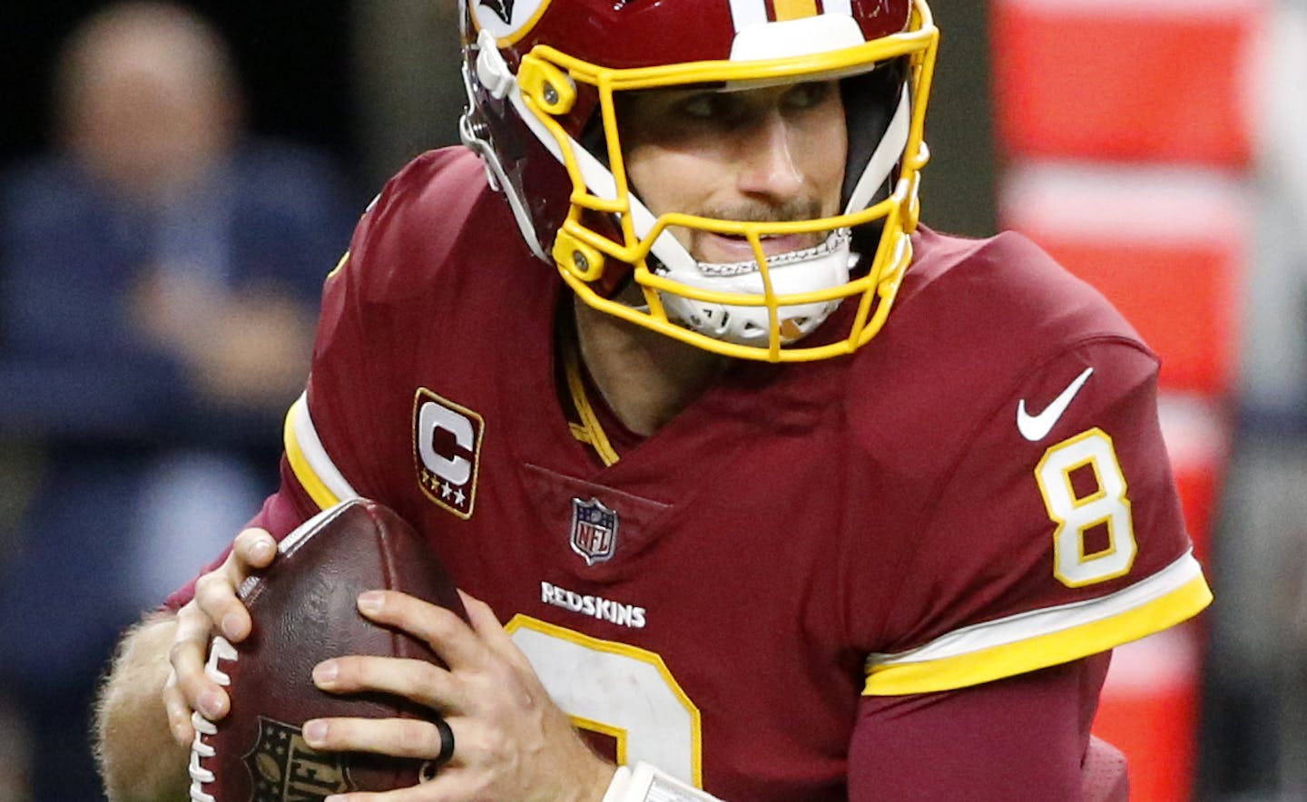 Washington Redskins quarterback Kirk Cousins (8) scrambles out of the pocket before throwing a pass during an NFL football game against the Dallas Cowboys on Thursday, Nov. 30, 2017, in Arlington, Texas. (AP Photo/Michael Ainsworth) ORG XMIT: OTKTG397