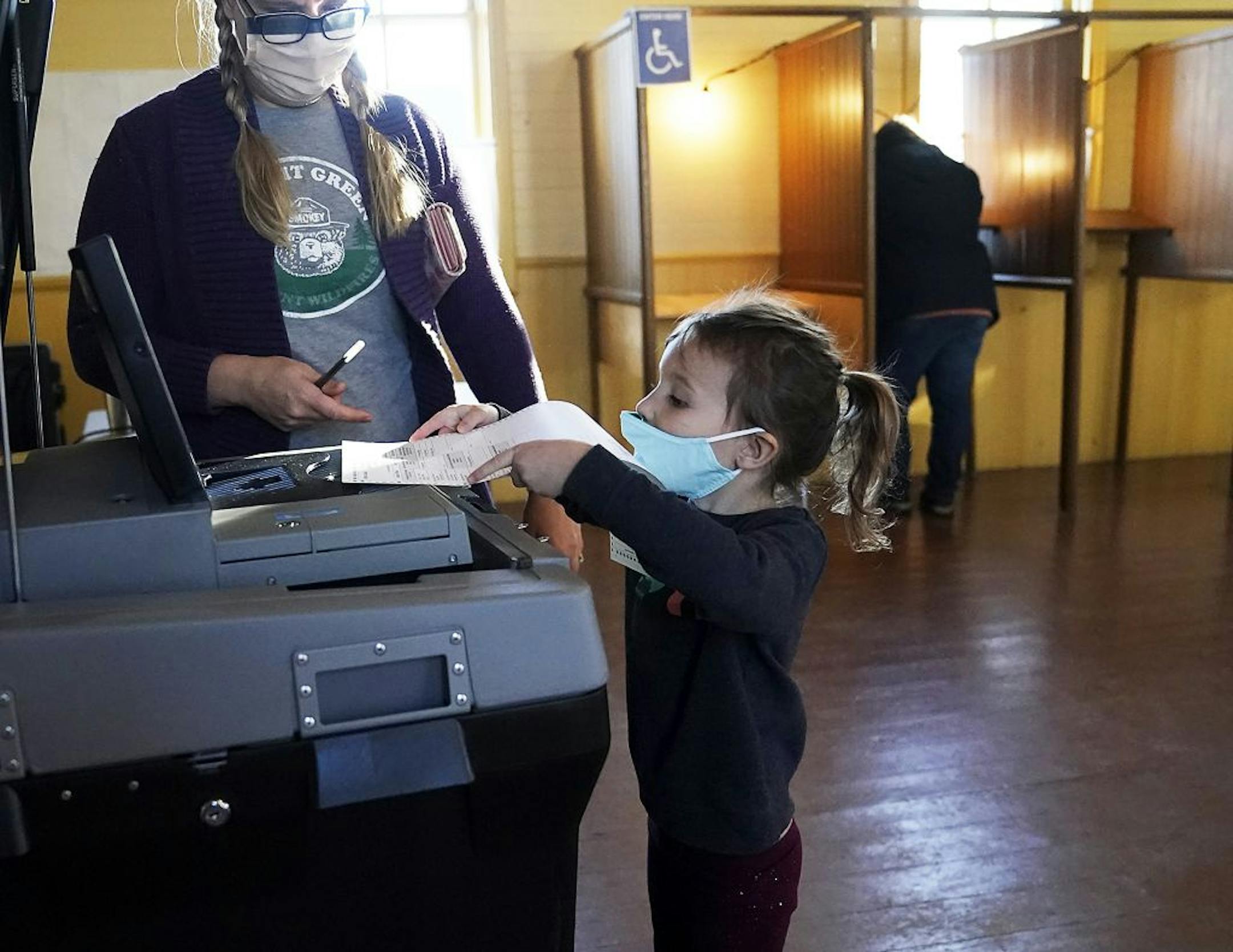 Laura Gesme of Vasa got help from daughter Isla, 4, while voting Tuesday at the Vasa Town Hall in Welch, MN