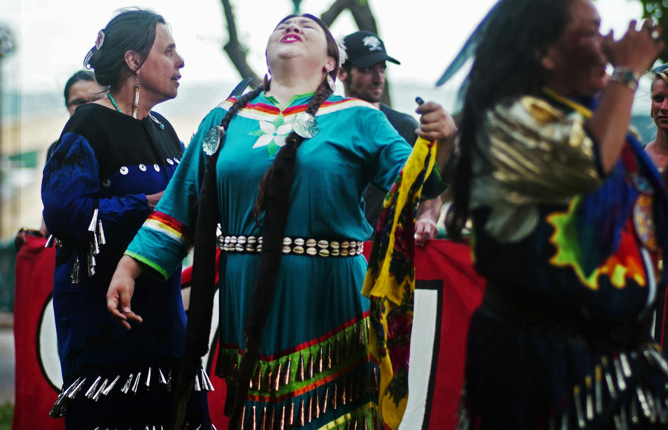 Winona LaDuke of Honor the Earth, and Grace Roberts, an enrolled member of the Mille Lacs Band of Ojibwe performed a jingle dance during a protest the Enbridge Energy Pipeline 3 protest at Kellogg Mall Park.] Honor the Earth, a national, Indigenous-led environmental non-profit organization founded by Winona LaDuke and based on the White Earth Reservation in Northern Minnesota, and other groups and individuals opposed to the new Enbridge Energy Pipeline 3 will speak and demonstrate today in oppos
