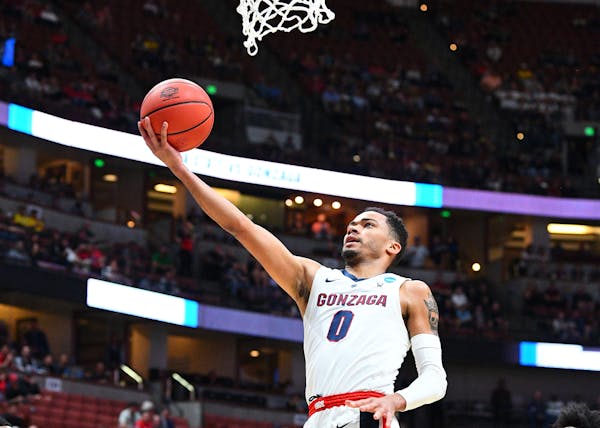 ANAHEIM, CA - MARCH 28: Gonzaga guard Geno Crandall (0) drives to the basket during the NCAA Division I Men's Championship Sweet Sixteen round basketb