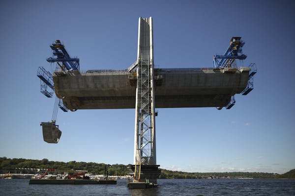 A segment was lifted from a barge beneath pier 9 of the St. Croix Crossing project under construction Thursday afternoon on the St. Croix River near S