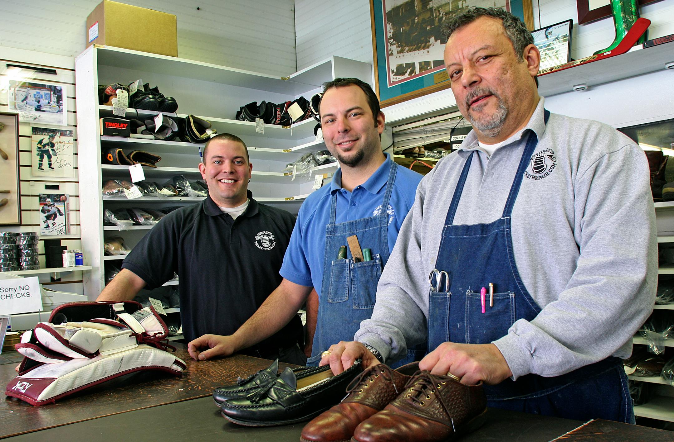 Dan and Brian George, at left, learned the cobbling and hockey equipment business from their dad, Jerry, right. Jerry, in turn, had learned from his father. Jerry's grandfather, was a cobbler who had emigrated from Lebanon. The family's business is more than a century old.