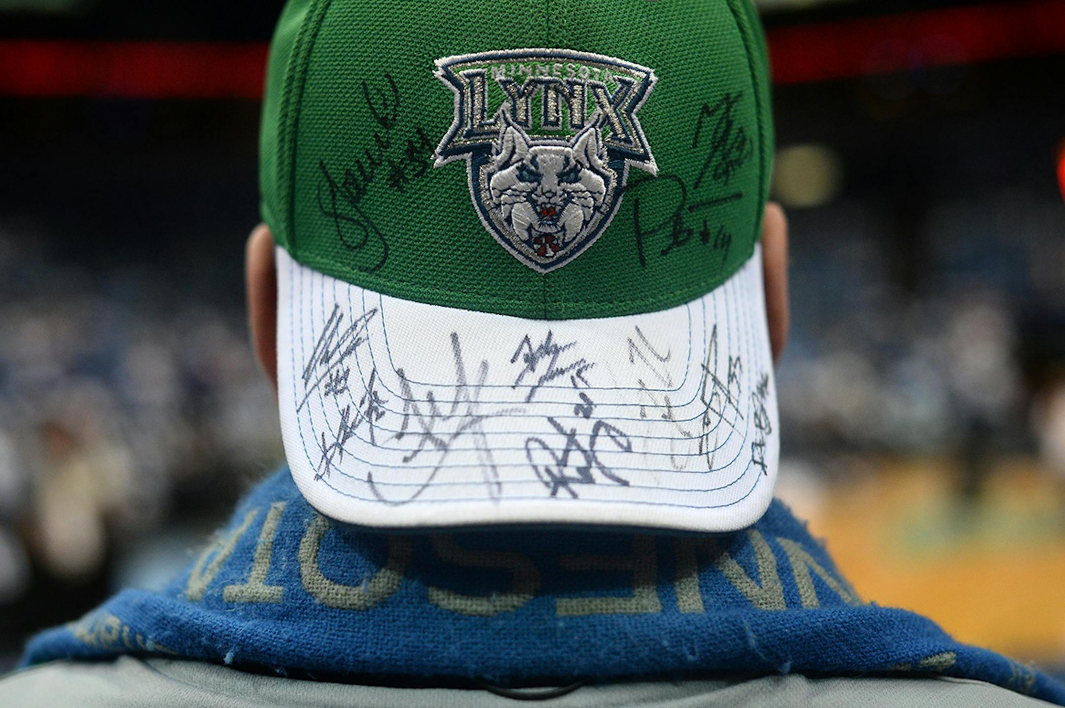Colin Titcomb, of Plymouth, wore a hat with most of the Lynx's signatures while watching pre-game warmups Wednesday.