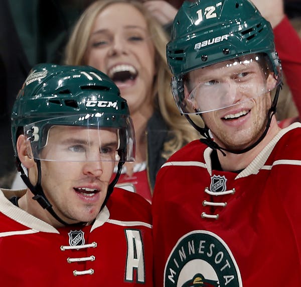 Zach Parise (11) and Eric Staal (12) celebrated after Parise scored an empty net goal in the third period. ] CARLOS GONZALEZ cgonzalez@startribune.com