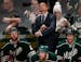 Minnesota Wild head coach Mike Yeo watched a replay of an empty net goal late in the third period. Chicago beat Minnesota by a final score of 4-2. ] C