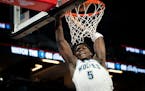 Minnesota Timberwolves shooting guard Anthony Edwards (5) dunks the ball in the second half of the NBA game against the Indiana Pacers at Target Cente