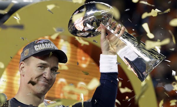 Denver Broncos&#x2019; Peyton Manning holds up the trophy after the NFL Super Bowl 50 football game Sunday, Feb. 7, 2016, in Santa Clara, Calif. The B