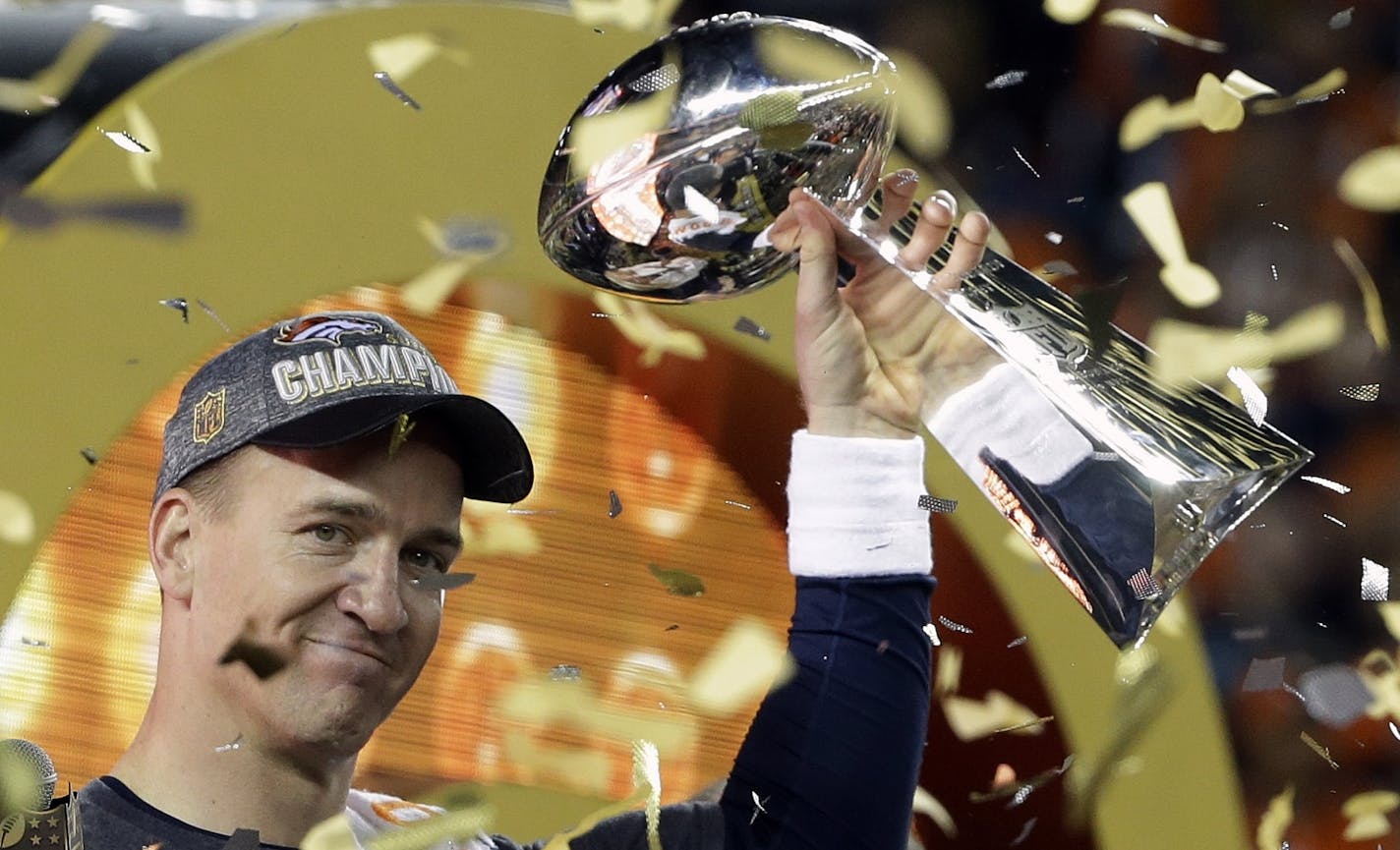 Denver Broncos&#x2019; Peyton Manning holds up the trophy after the NFL Super Bowl 50 football game Sunday, Feb. 7, 2016, in Santa Clara, Calif. The Broncos won 24-10. (AP Photo/Julie Jacobson)