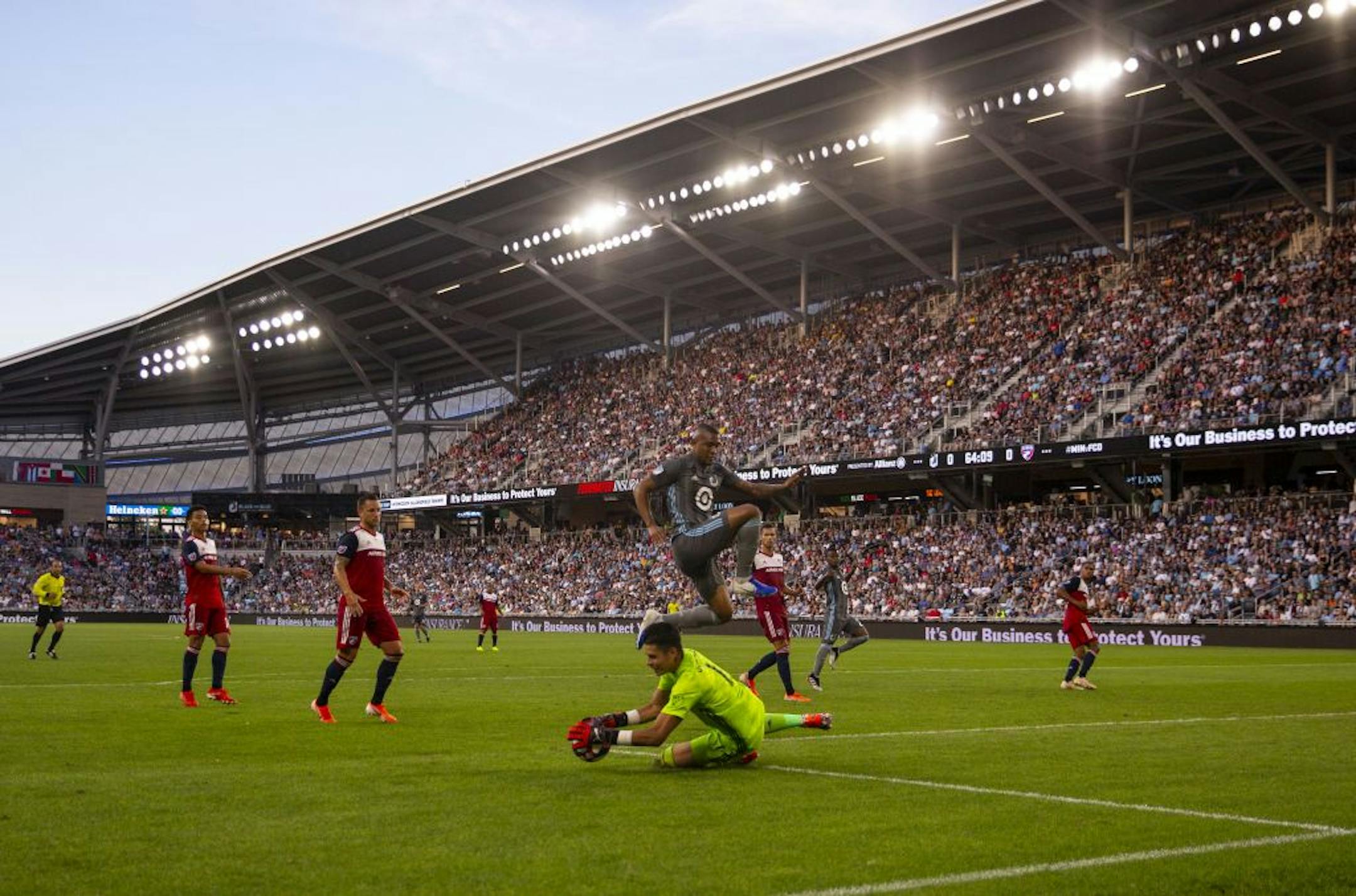 Minnesota FC forward Angelo Rodriguez (9) jumps over FC Dallas goalkeeper Jesse Gonzalez (1). ALEX KORMANN ¥ alex.kormann@startribune.com The Minnesota United FC took on FC Dalls on Saturday July 13, 2019 at Allianz Field in St. Paul, MN.