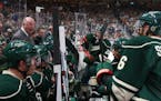 Minnesota Wild head coach Bruce Boudreau gives his players instructions during Saturday's home opener in St. Paul.