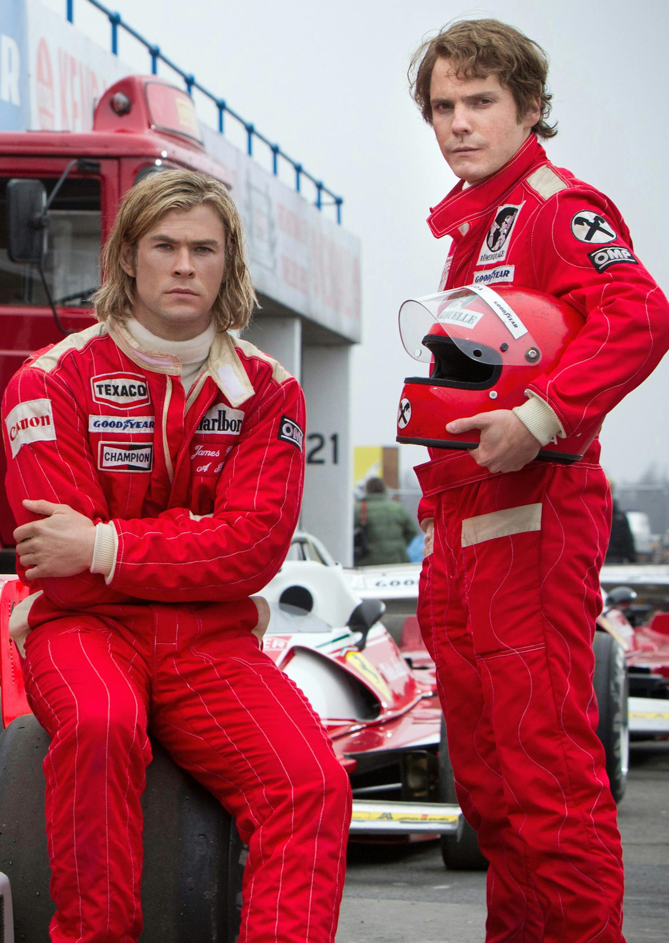 This image released by Universal Pictures shows Chris Hemsworth, left, and Daniel Bruhl in a scene from "Rush." (AP Photo/Universal Pictures, Jaap Buitendijk) ORG XMIT: MIN2013092316150407