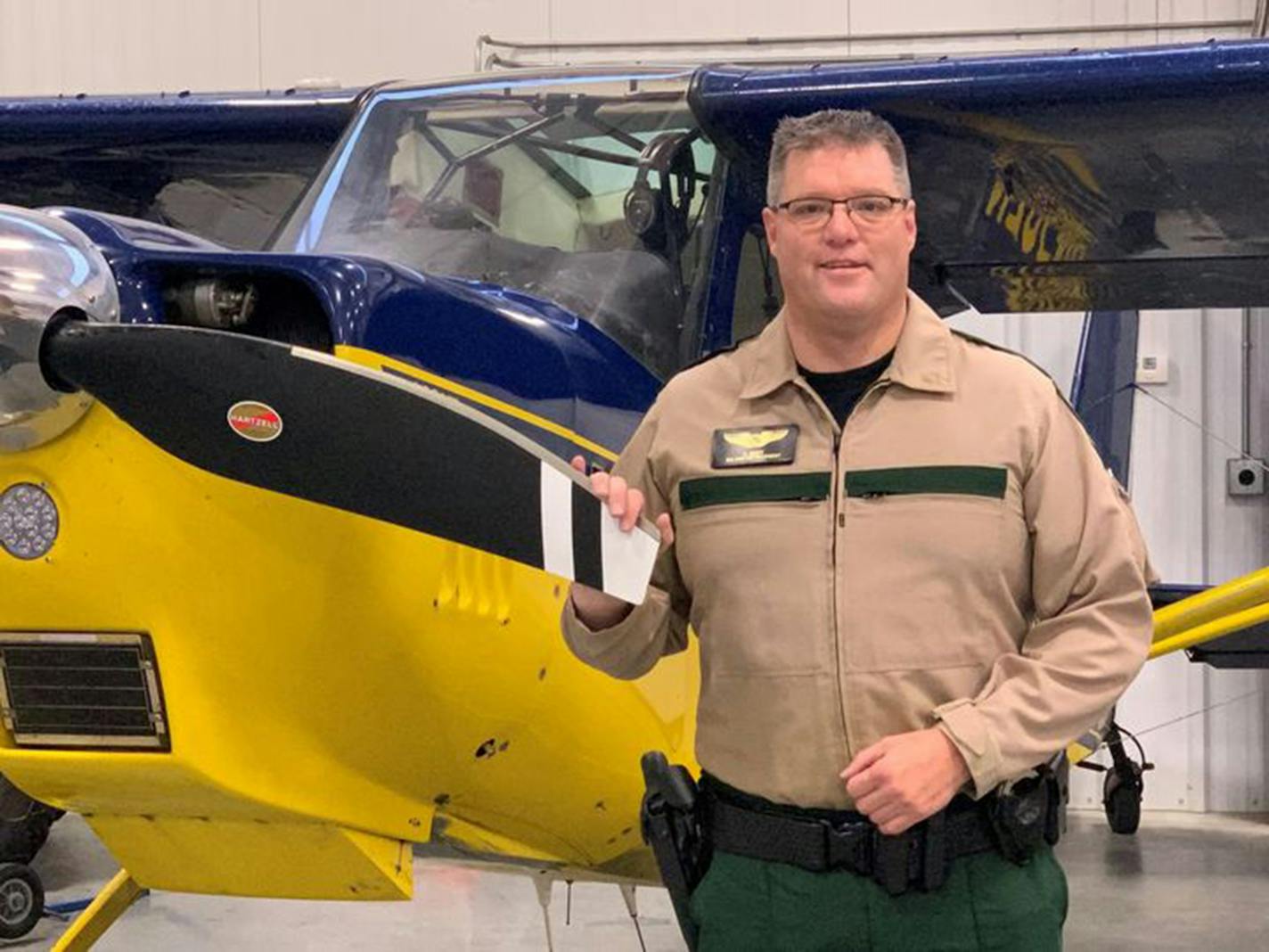 DNR Conservation Officer Charles Scott spotted the lost hunter from the air and directed rescuers on the ground to the location. They aided him out of the woods just as night was falling.