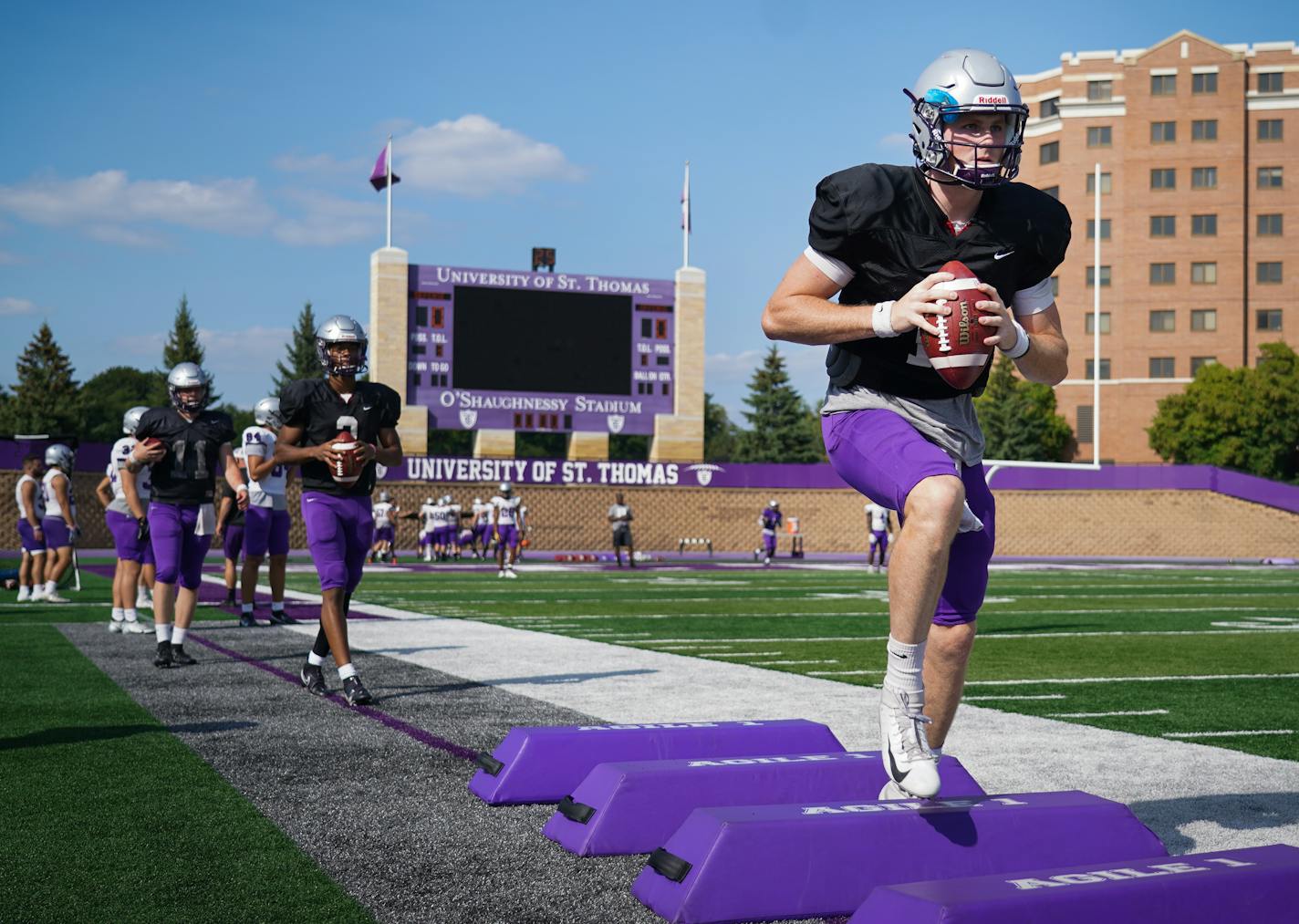 St. Thomas quarterback Tommy Dolan (18) ran drills during practice inside O'Shaughnessy Stadium on Wednesday, Sept. 1, 2021.