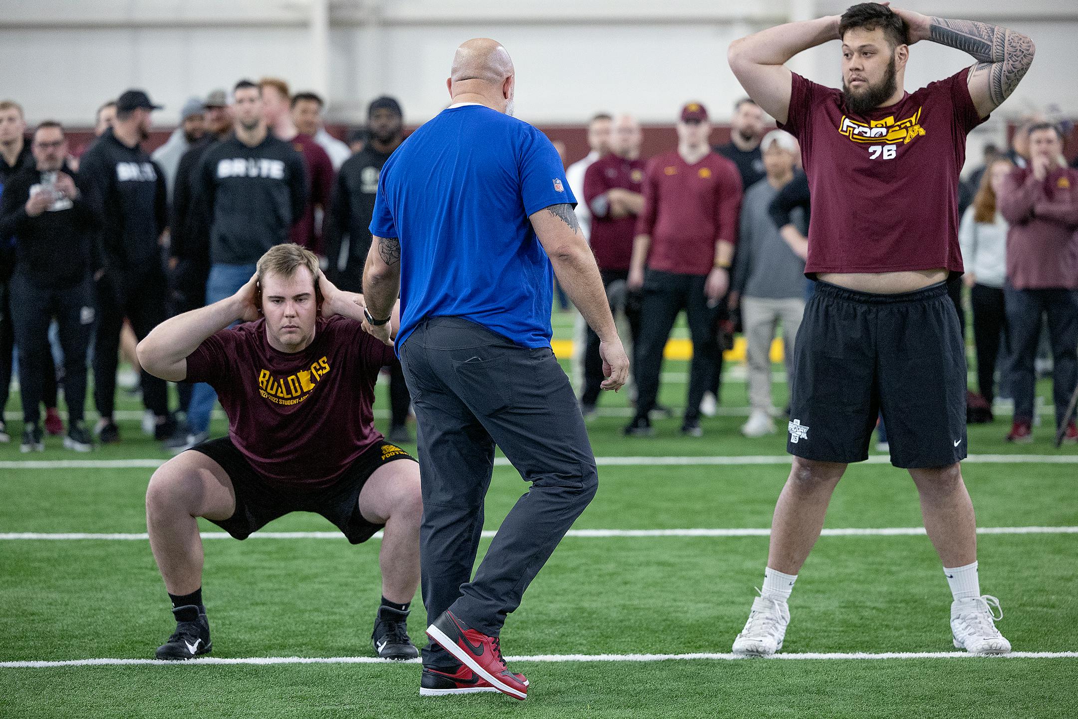 Duluth Center Brent Laing, left, and Minnesota's Chuck Filiaga performs for scouts during the Minnesota Pro Day.