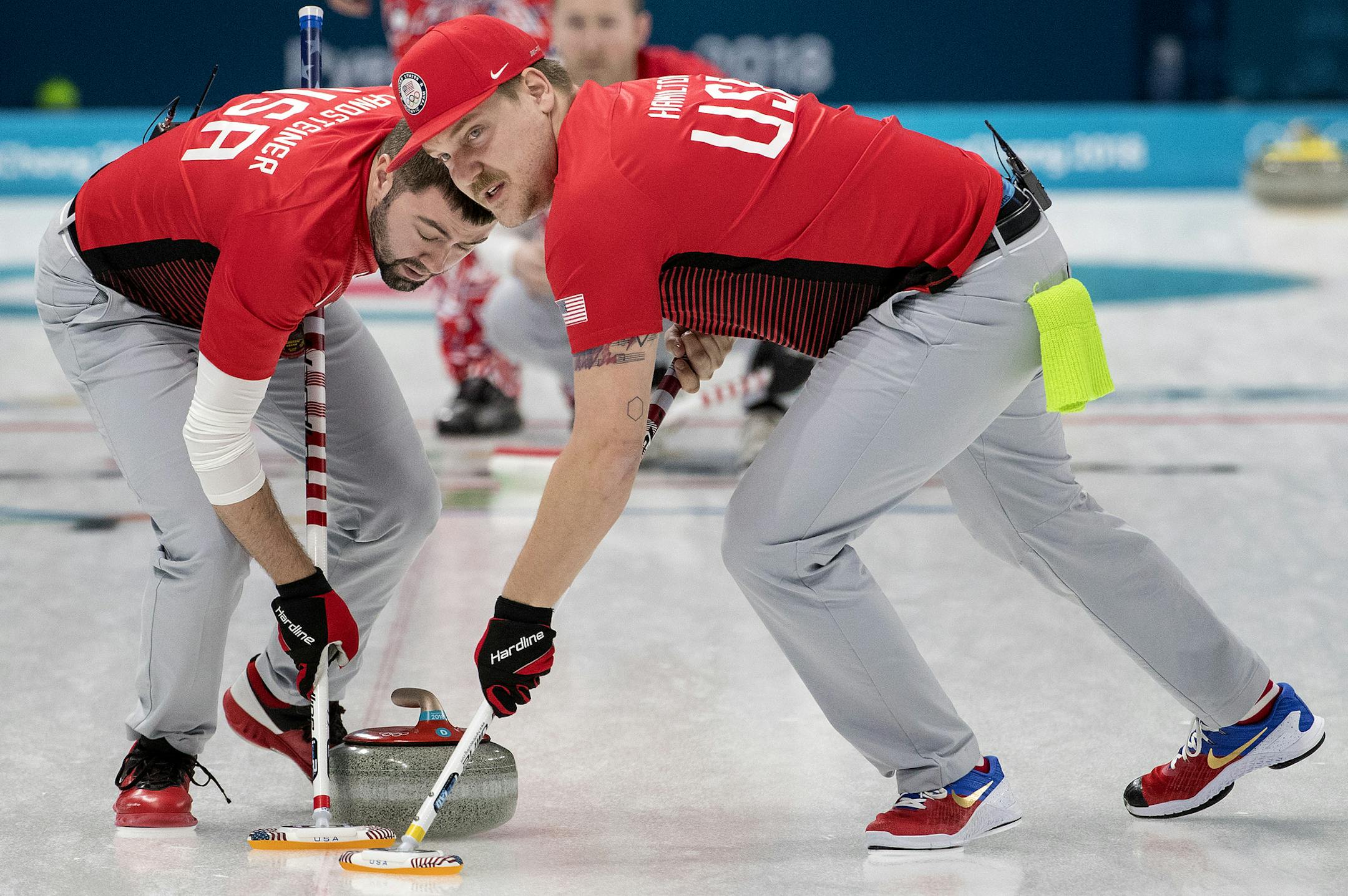 John Landsteiner and Matt Hamilton swept in front of the rock during a match against Norway on Sunday night at Gangneung Curling Center. ] CARLOS GONZALEZ ï cgonzalez@startribune.com - February 18, 2018, South Korea, 2018 Pyeongchang Winter Olympics, Gangneung Curling Center, USA vs. Norway