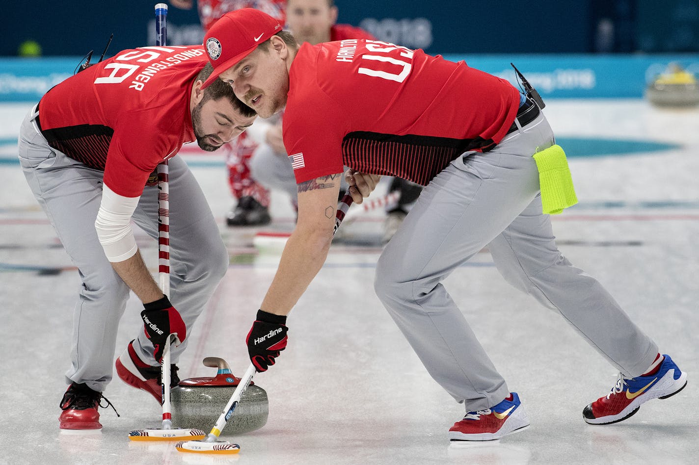 John Landsteiner and Matt Hamilton swept in front of the rock during a match against Norway on Sunday night at Gangneung Curling Center. ] CARLOS GONZALEZ &#xef; cgonzalez@startribune.com - February 18, 2018, South Korea, 2018 Pyeongchang Winter Olympics, Gangneung Curling Center, USA vs. Norway