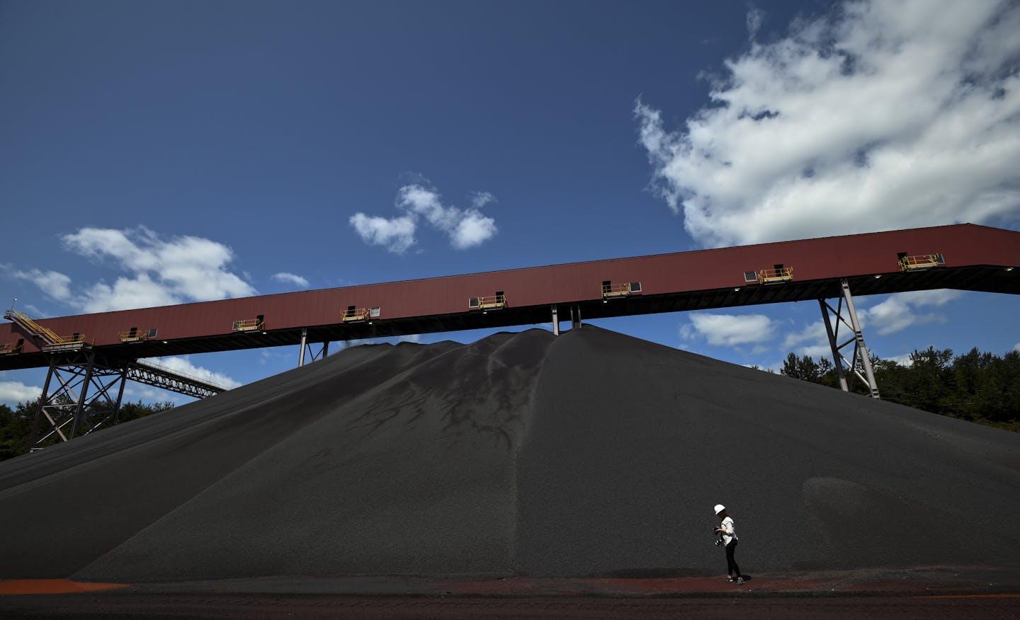 Media members photographed a pile of Cleveland-Cliffs' new DR-grade pellets Tuesday afternoon. ] Aaron Lavinsky ¥ aaron.lavinsky@startribune.com Cleveland-Cliffs held a press conference and ribbon cutting ceremony to celebrate the completion of the company's DR-Grade Pellet Project at Northshore Mining in Silver Bay, Minn on Tuesday, Aug. 6, 2019. Following the ribbon cutting, members of the media were given a tour of parts of the facility.