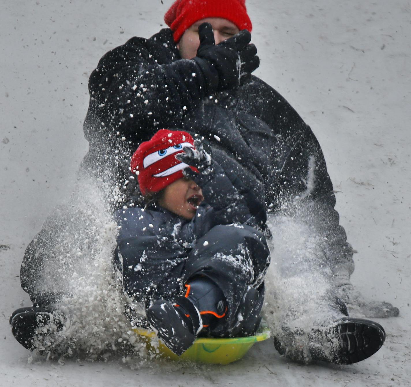 At the sledding hill at French Regional Park, Thomas Saarela and nephew Zanny,7 kicked up some snow on the way down .] rtsong-taatarii@startribune.com/ Richard Tsong-Taatarii