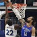 Oklahoma City Thunder's Steven Adams, right, of New Zealand, blocks a shot by Minnesota Timberwolves' Andrew Wiggins during the second half of an NBA 