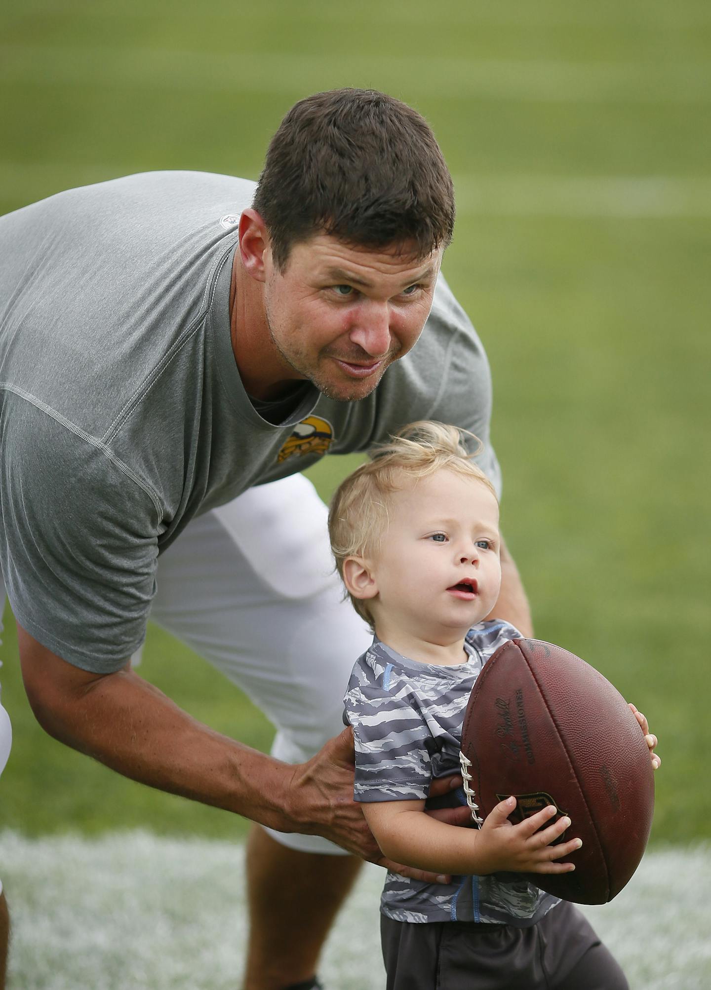 Shaun Hill played with his 18-month-old son Theo after practice at Vikings training camp at Minnesota State University Mankato Tuesday July 28, 2015 in Mankato, MN. ] Jerry Holt/ Jerry.Holt@Startribune.com