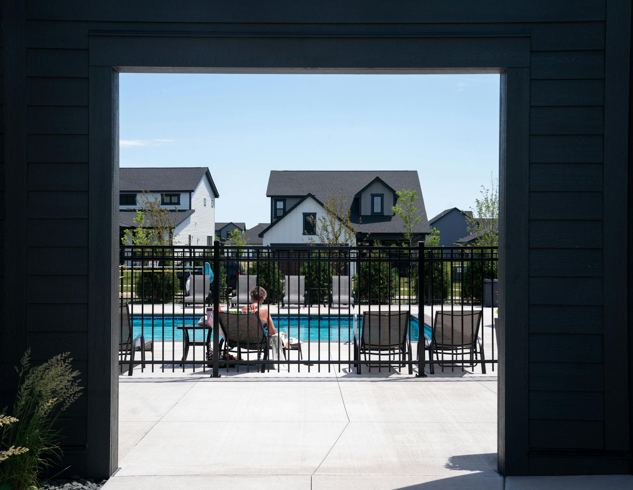 Resident Patricia Johansen-Strain lounged by the pool at Canvas at Woodbury. She has lived there for nearly a year.