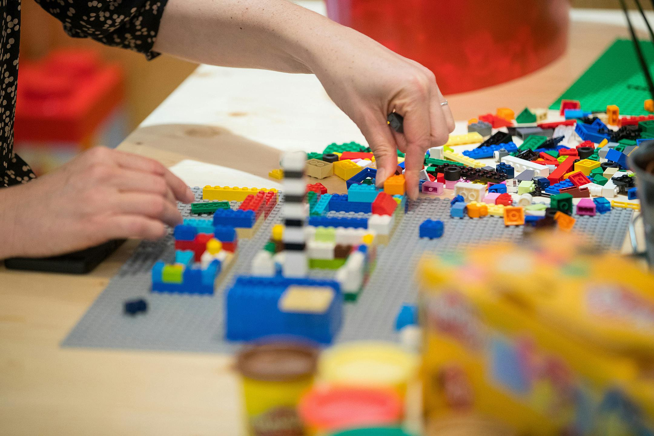 An employee assembles a model with Lego toy bricks in a rest area during the opening of the Robert Bosch Internet of Things campus in Berlin on Jan. 18, 2018. MUST CREDIT: Bloomberg photo by Krisztian Bocsi.