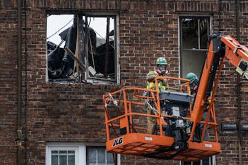 Careful demolition of the Francis Drake hotel has begun. Crew members used hazmat masks because of residue toxic fumes.