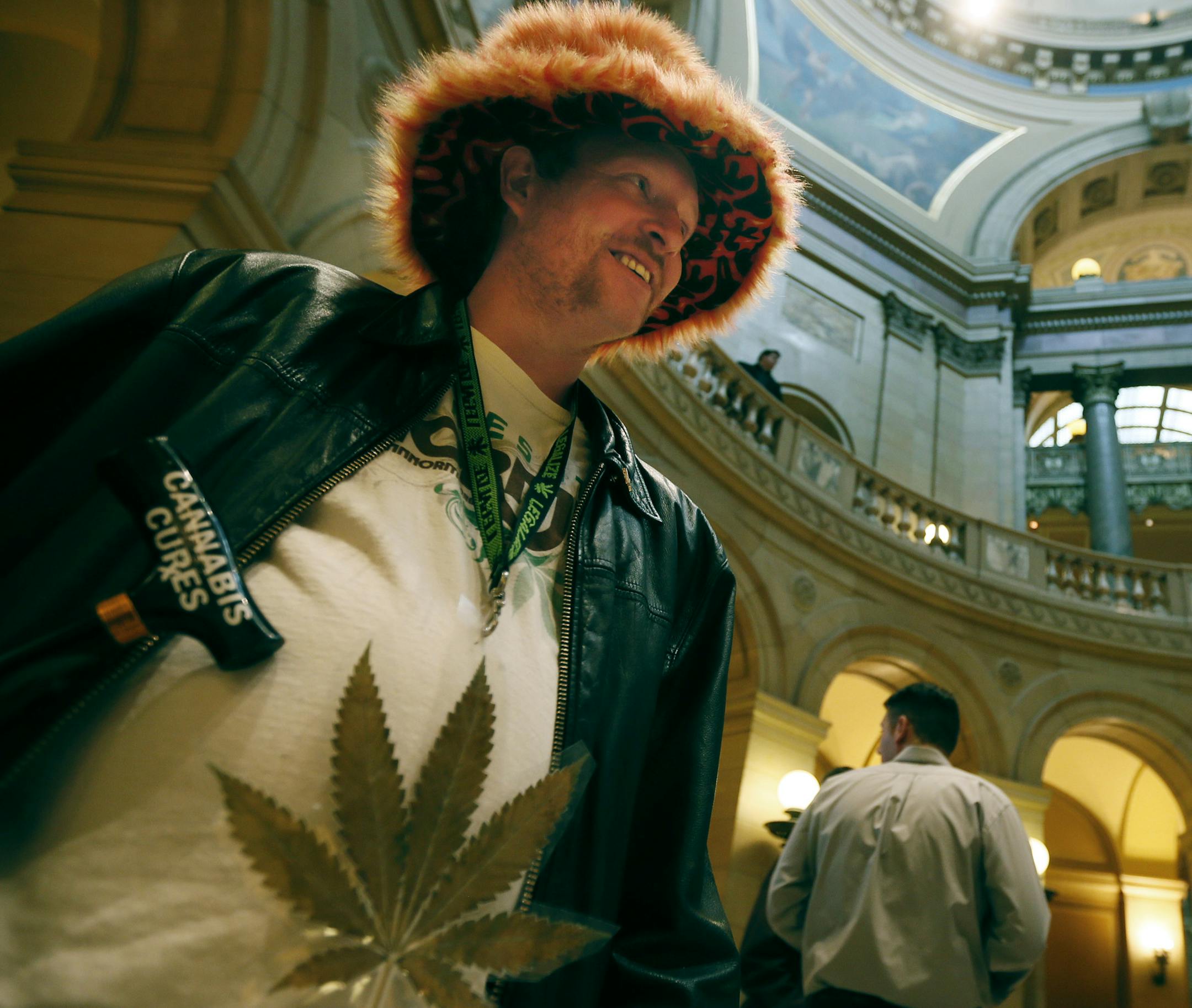 Jeff Baker of Oakdale dressed for the part at the State Capitol rotunda, where chants of “Yes We Cannabis!” rang out.