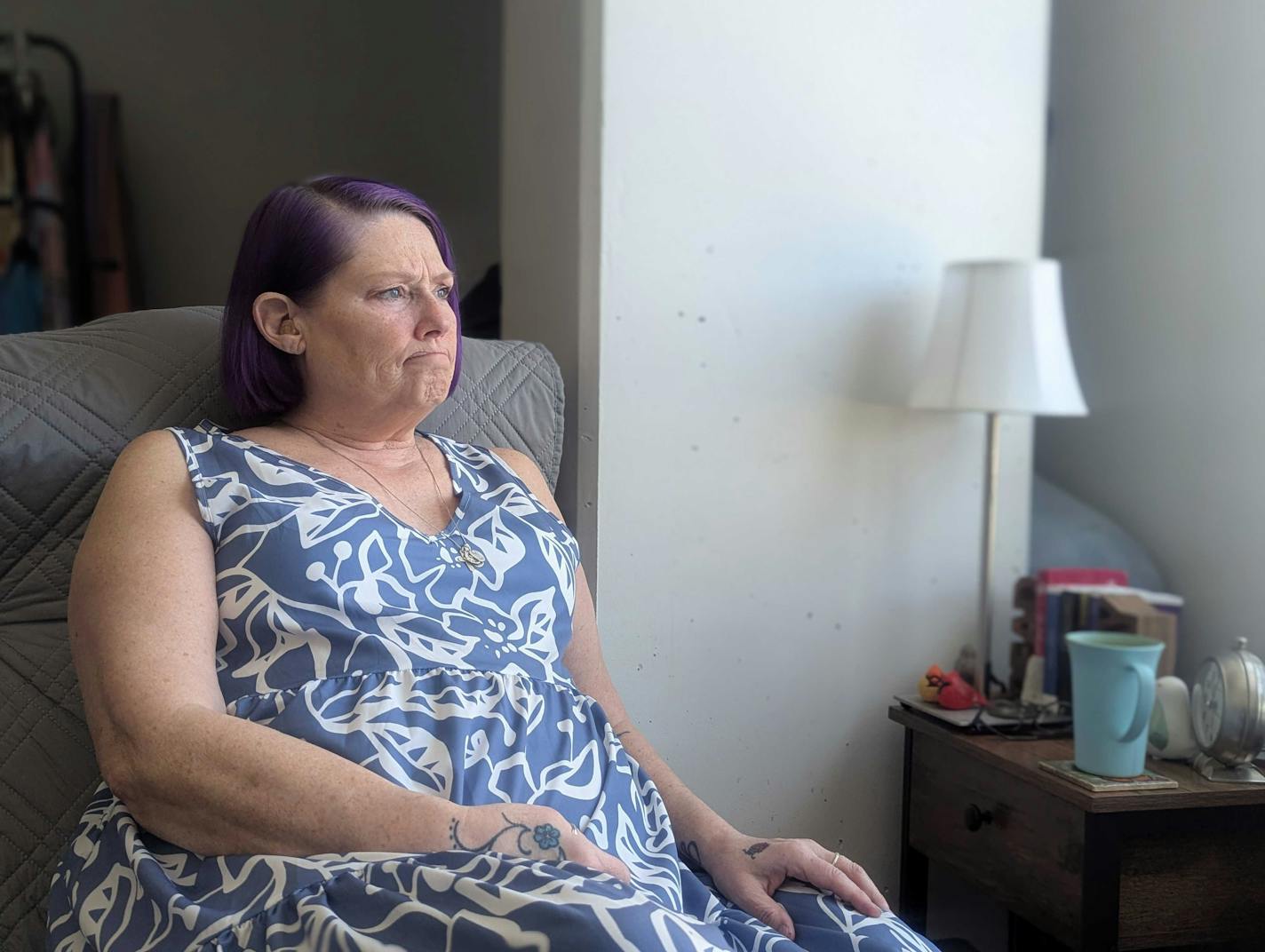 Kristine Maassen sits in her new unit after being homeless in the Twin Cities.