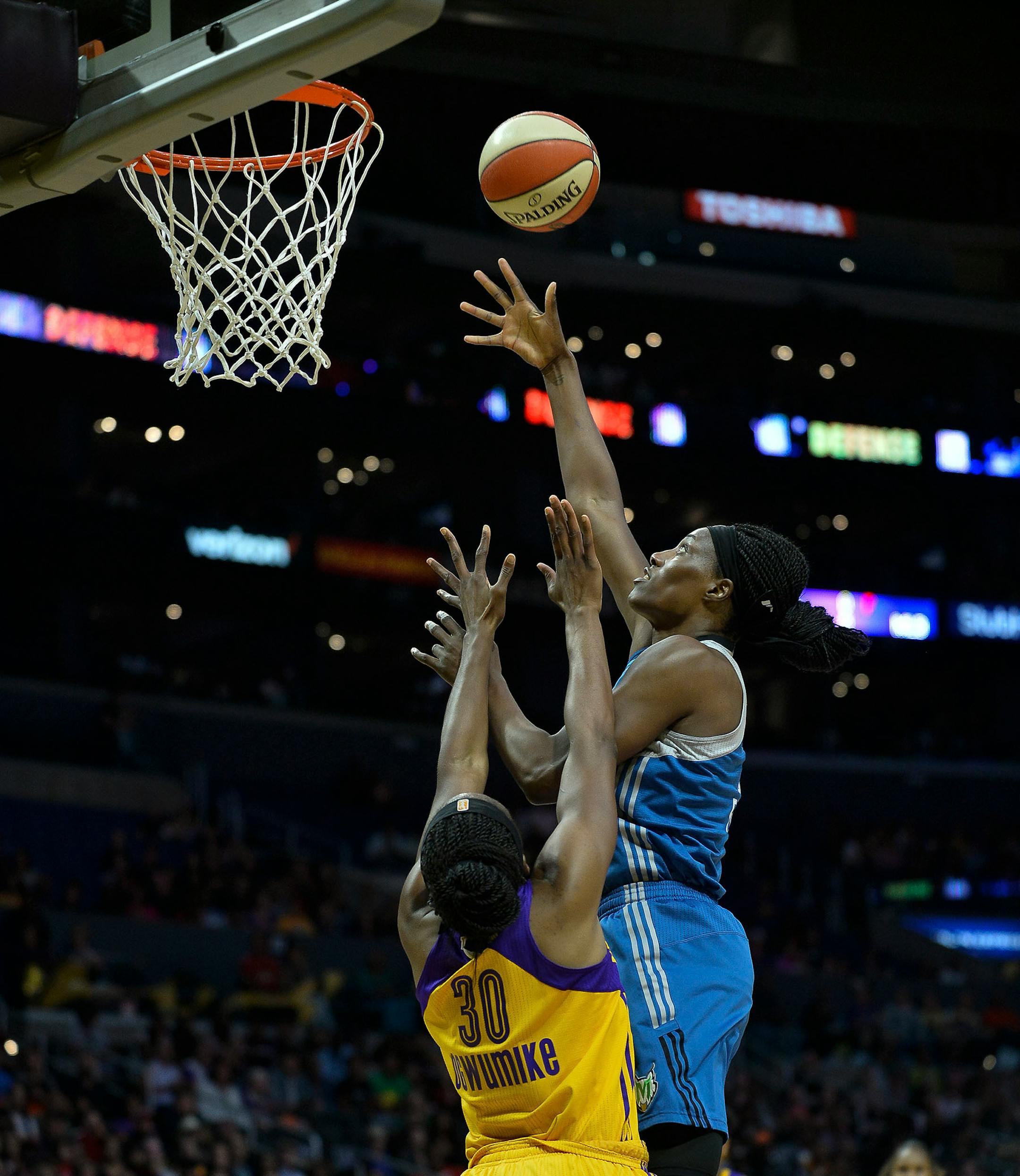 Minnesota Lynx center Sylvia Fowles (34) scored a basket over Los Angeles Sparks forward Nneka Ogwumike (30) in the first half.