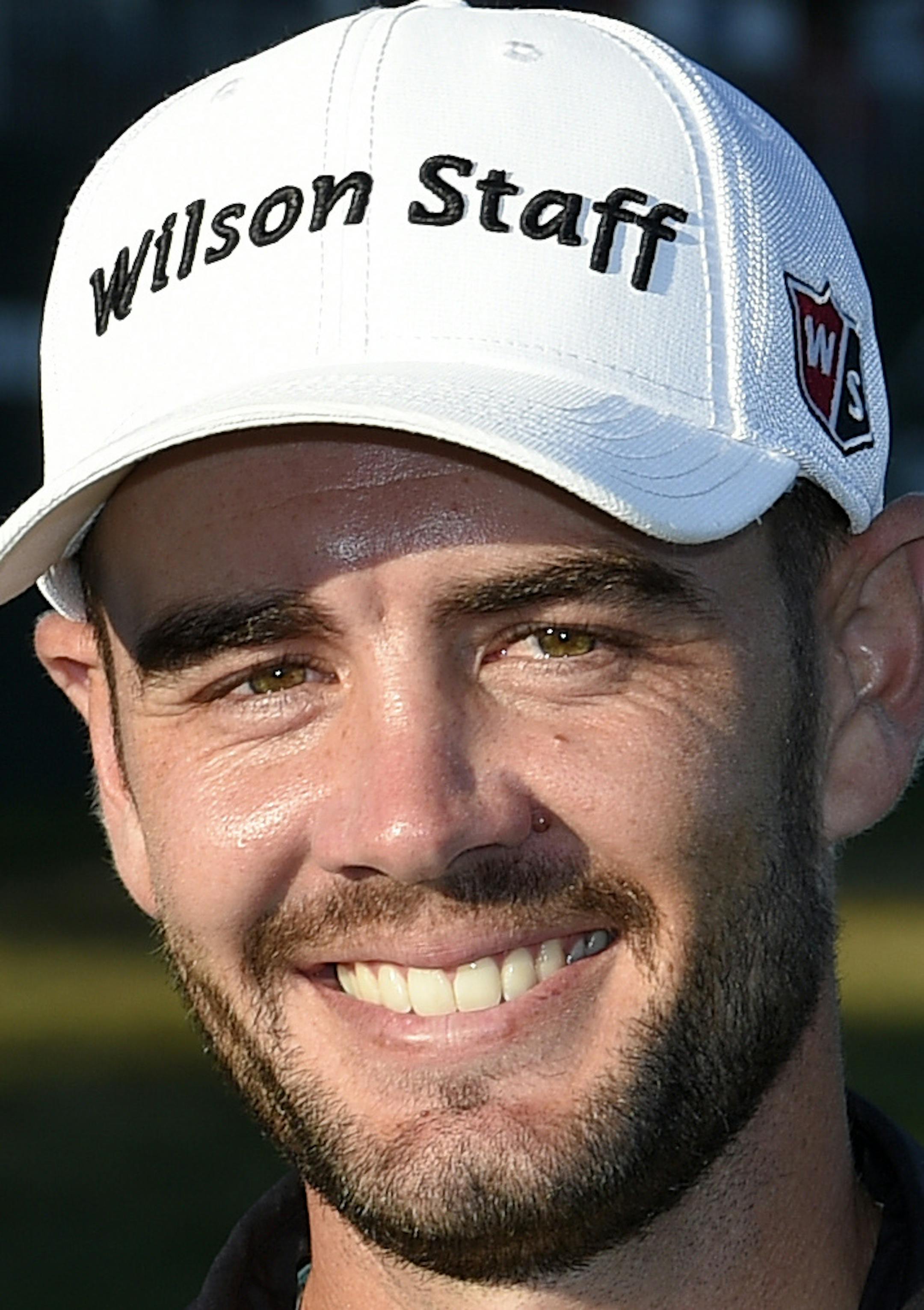 Troy Merritt poses with the trophy after he won the Quicken Loans National golf tournament at the Robert Trent Jones Golf Club in Gainesville, Va., Sunday, Aug. 2, 2015. (AP Photo/Nick Wass)