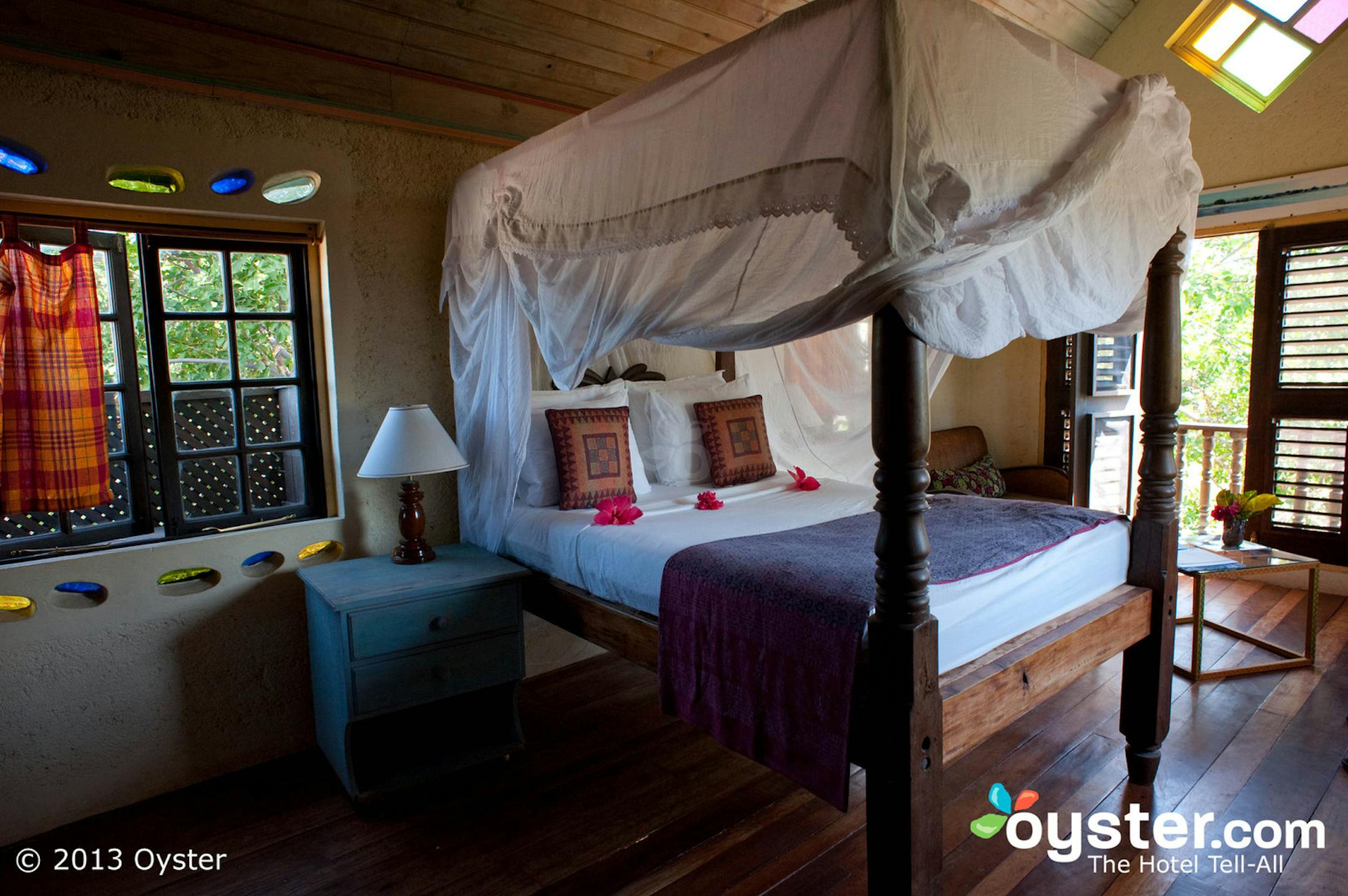 Cowrie No. 1 at Jake's in Jamaica features canopied beds, colored glass, rustic wooden decor and more. (Oyster.com/MCT) ORG XMIT: 1135301