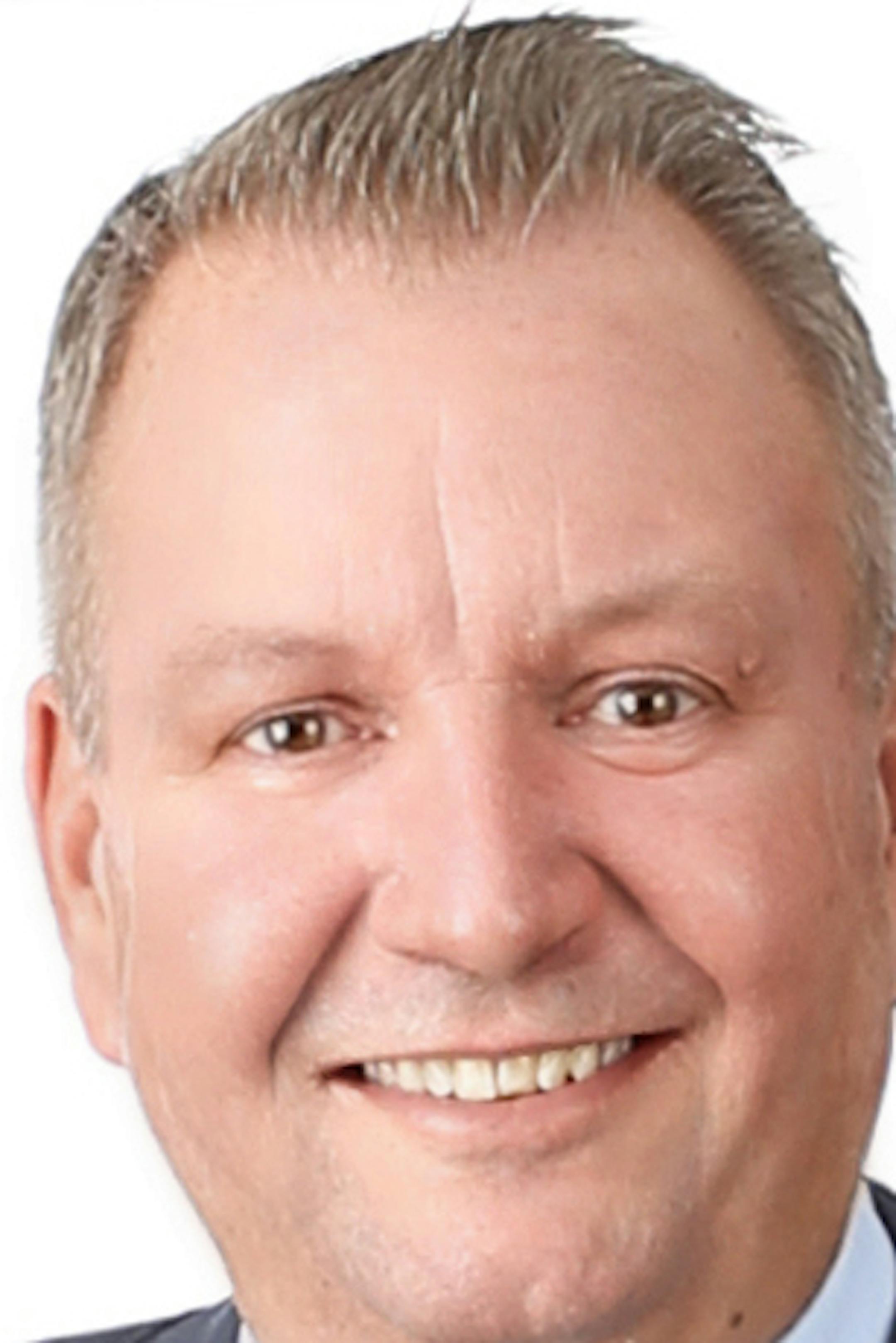 John Smaby, a longtime sales manager for Edina Realty, was recently elected to the top position with the National Association of Realtors after a three-year campaign. He's only the second in the state to hold this position, his father was the first. credit: Sarah Pierce Photography