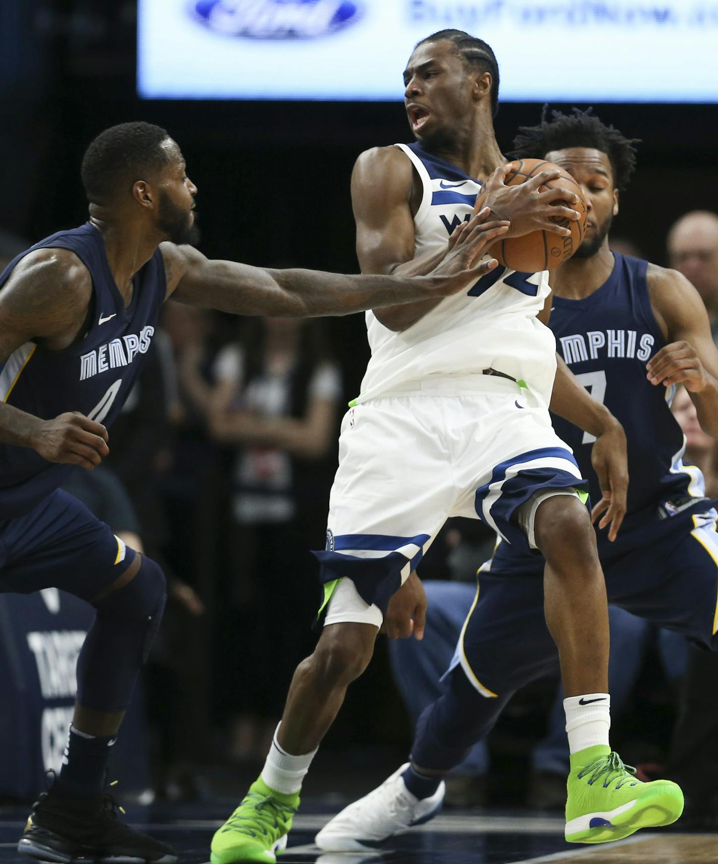 Minnesota Timberwolves forward Andrew Wiggins (22) spun around and met the defense of the Grizzlies JaMychal Green (0) and Wayne Selden (7) late in the fourth quarter. Wiggins had 18 points for the night. ] JEFF WHEELER &#xef; jeff.wheeler@startribune.com The Minnesota Timberwolves lost to the Memphis Grizzlies 101 - 93 in an NBA basketball game Monday night, March 26, 2018 at Target Center in Minneapolis.