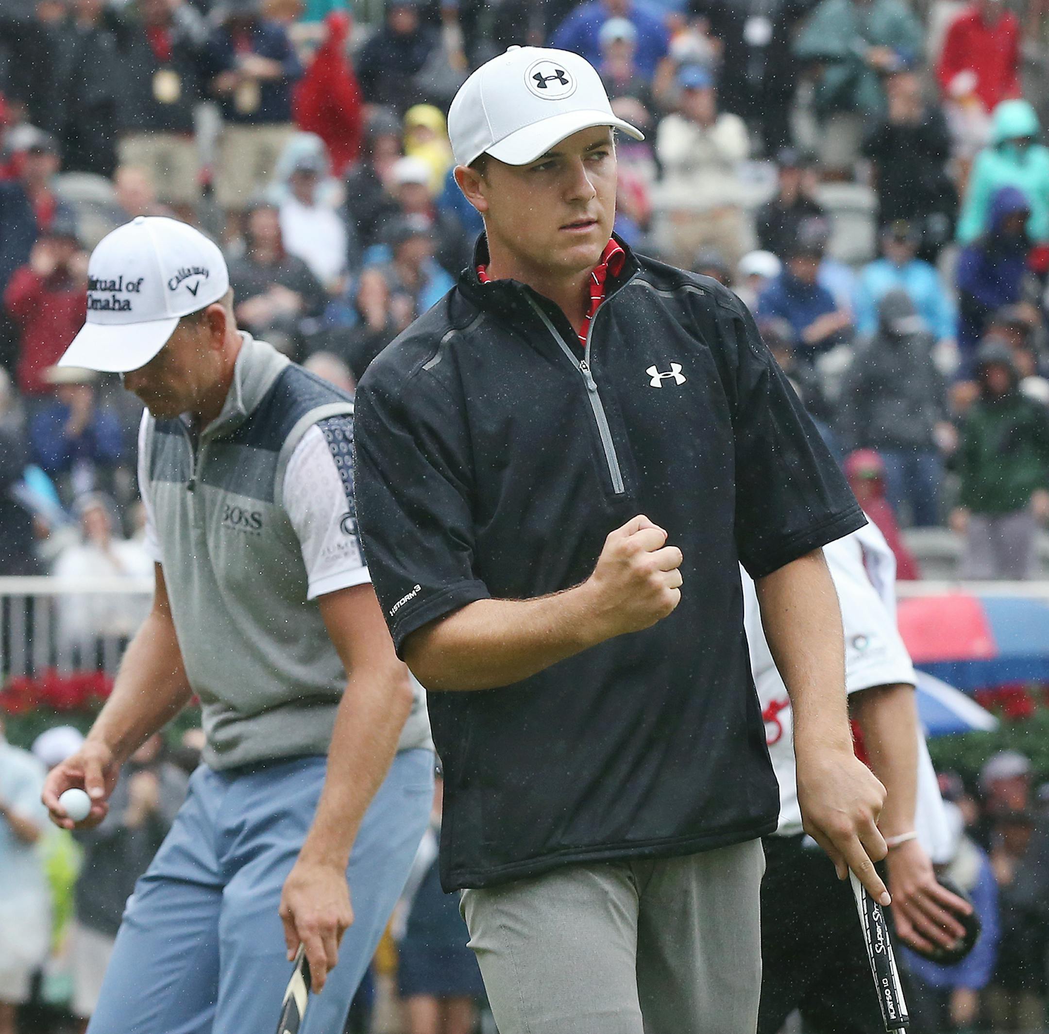 Jordan Spieth, right, pumps his fist making his birdie putt on the 18th hole to take a one stroke lead over Henrik Stenson, left, during the Tour Championship at East Lake Golf Club on Saturday, Sept. 26, 2015, in Atlanta. Spieth finished the day at 8-under par. (Curtis Compton/Atlanta-Journal Constitution via AP) MARIETTA DAILY OUT, GWINNETT DAILY POST OUT, LOCAL TV OUT (WXIA, WGCL, FOX 5)