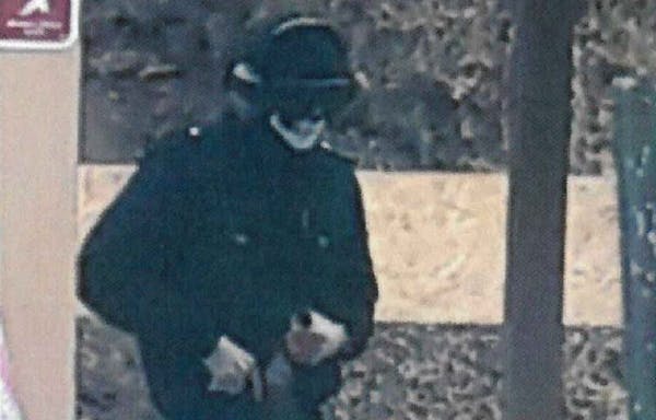 FBI agents captured this photo of River William Smith wearing a Punisher mask as he practiced shooting at a Prior Lake gun range this year.
