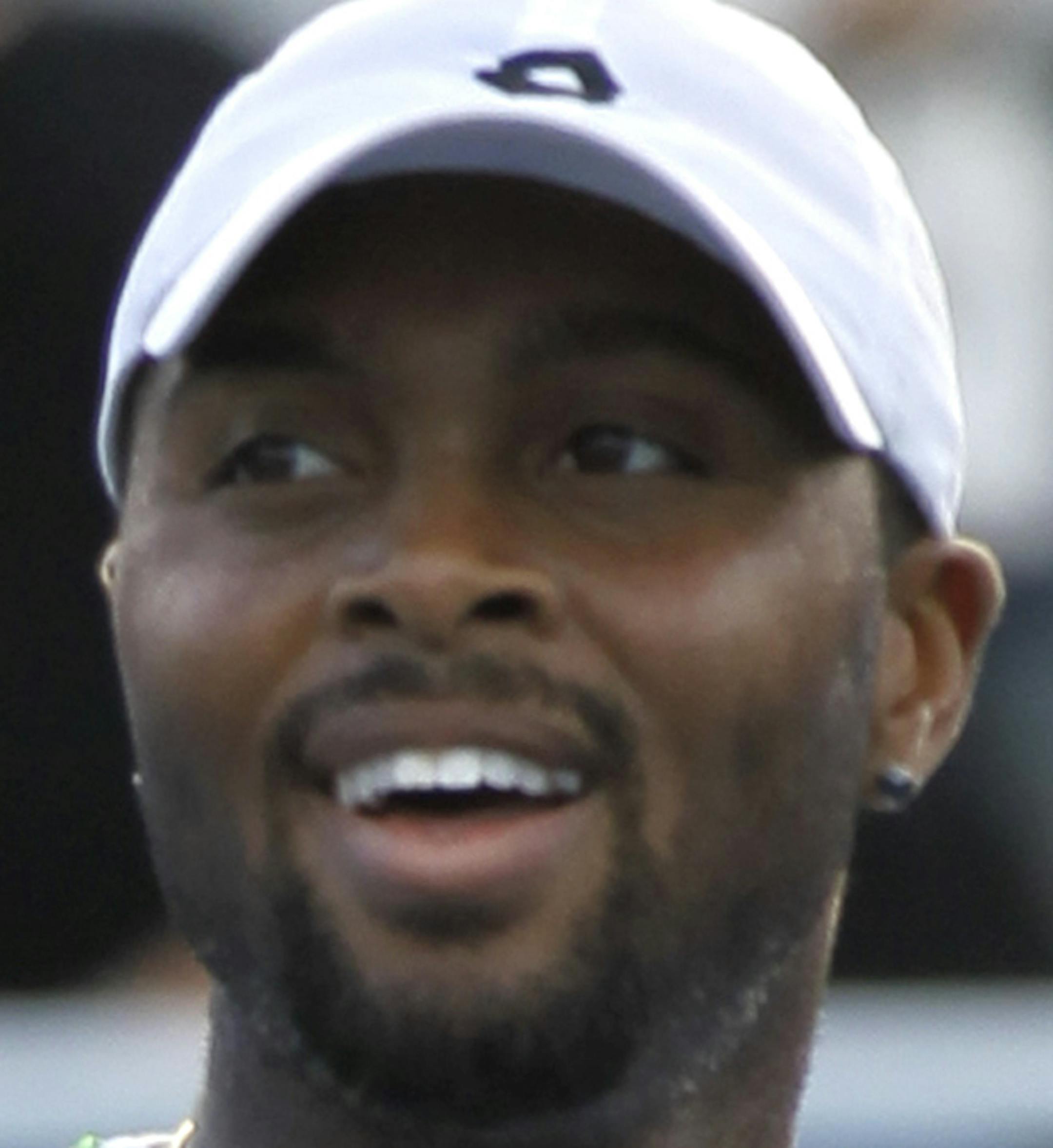 Donald Young rects after defeating Bernard Tomic, of Australia, 4-6, 6-4, 6-2, in a a semi-final tennis match at the Delray Beach Open, Saturday, Feb. 21, 2015, in Delray Beach, Fla. (AP Photo/Luis M. Alvarez)