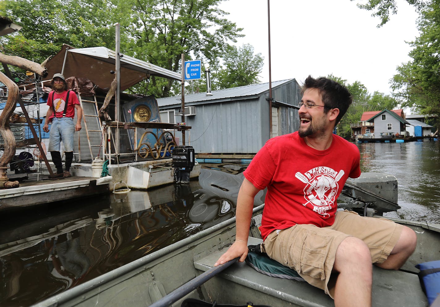 Moses Simon, a Winona boathouse owner, was born in his family's boathouse on the Mississippi but the family moved away when he was 4. But the lure of the river has drawn him back. Now the owner of his family's old boathouse, Simon is building a new one next to it and was seen boating by a neighbor while heading into his place on the Mississippi River on Wednesday, June 12, at the boathouse community.