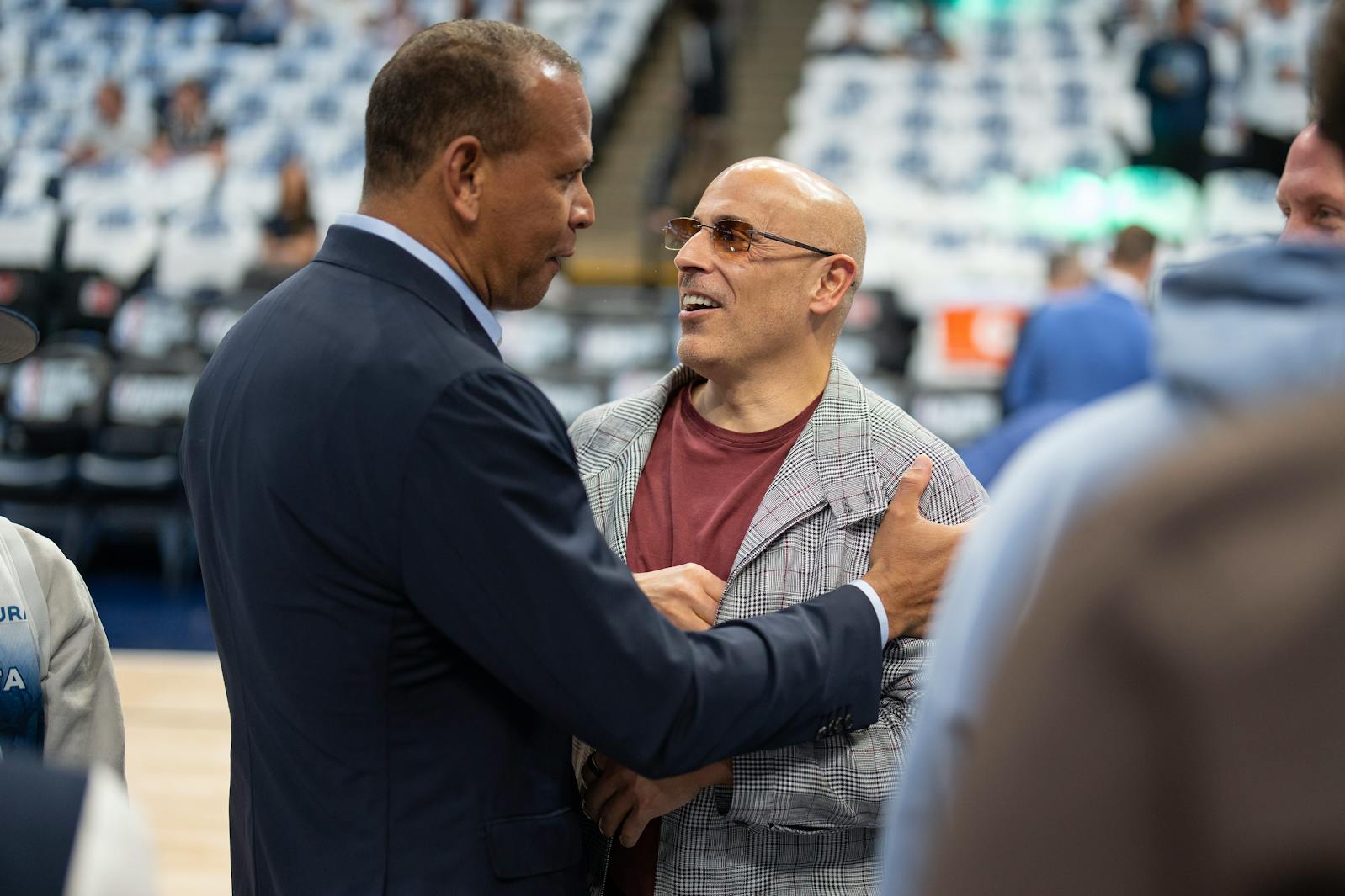 Alex Rodriguez and Marc Lore chat courtside before a Timberwolves playoff game at Target Center on May 24.