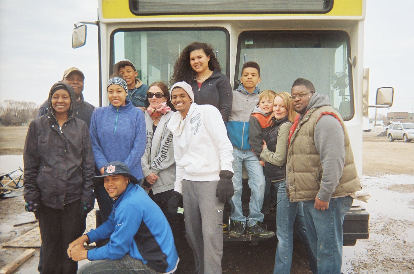 Submitted photo On Saturday April 19, a group of volunteers gathered at a St. Paul bus lot to begin rehabbing an old Metro Transit bus with Art ASAP. The volunteers worked together to remove seats and railings from the bus and they swept the floor. They'll continue working on the bus through mid-May. Art ASAP plans to launch an art program on the bus in June. From left to right: Chantele Burgess (black jacket), behind her Stanley Brown, alongside her in blue/purple top her daughter, Brandy Burge