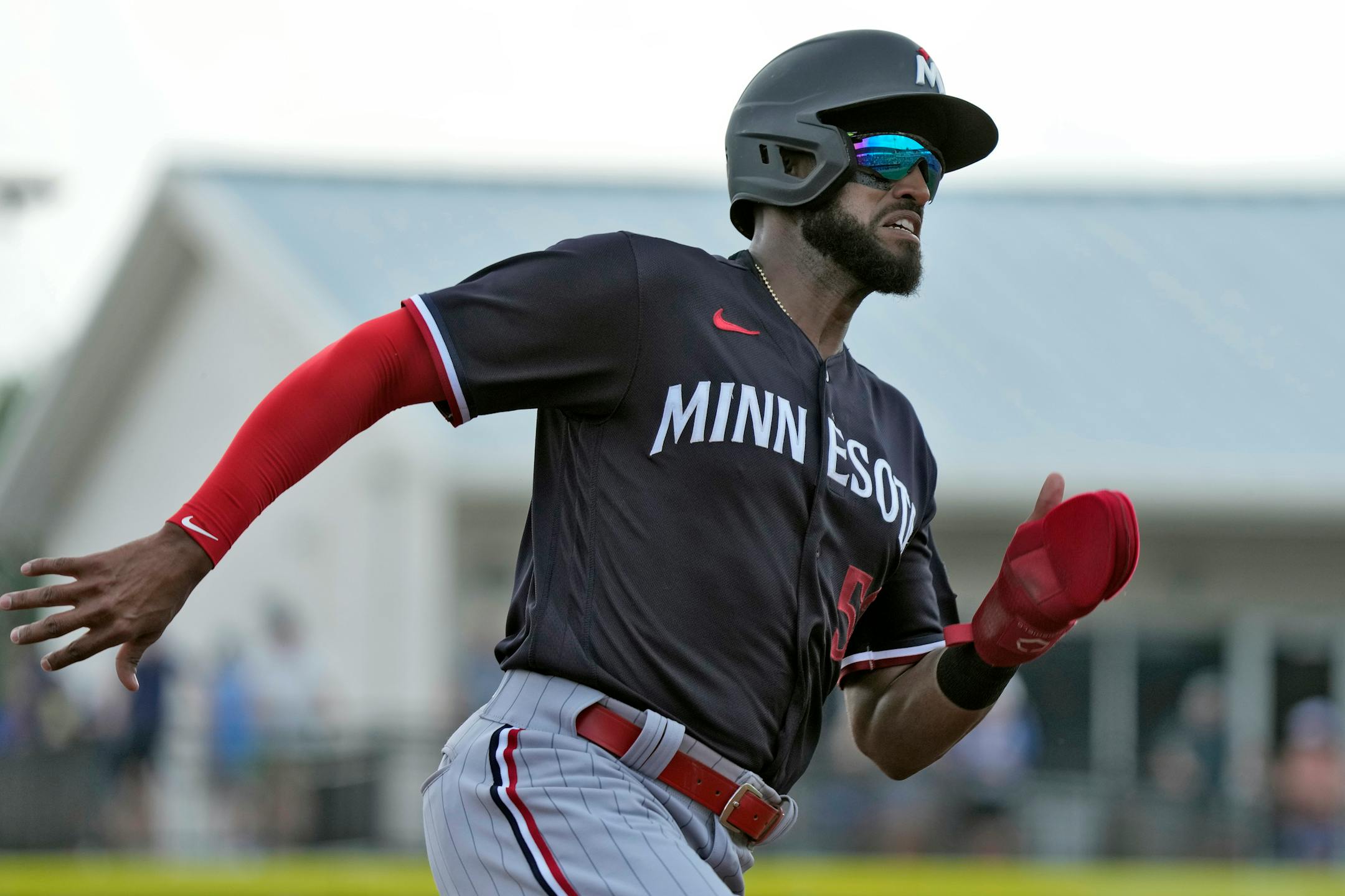 Minnesota Twins' Willi Castro races home to score on an RBI double by Matt Wallner off Toronto Blue Jays starting pitcher Alek Manoah during the fourth inning of a spring training baseball game Wednesday, March 8, 2023, in Dunedin, Fla. (AP Photo/Chris O'Meara)