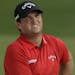 Patrick Reed hits from the bunker on the 18th hole during the final round of the PGA Championship golf tournament at the Quail Hollow Club Sunday, Aug
