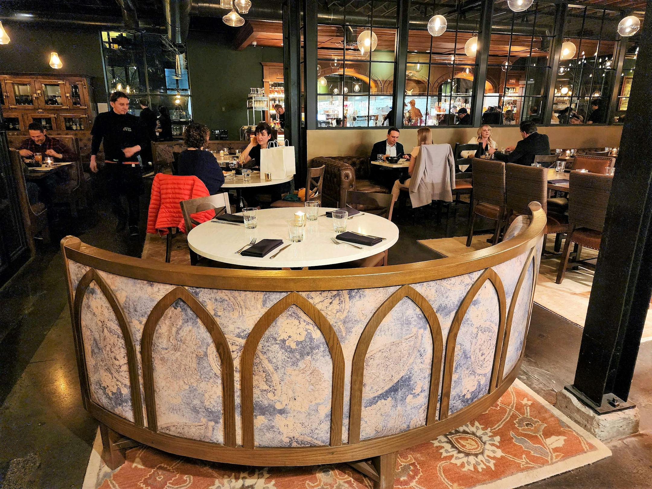 The layout favors large booths in varying styles, some intimate, some clubby and some in the center of the action.