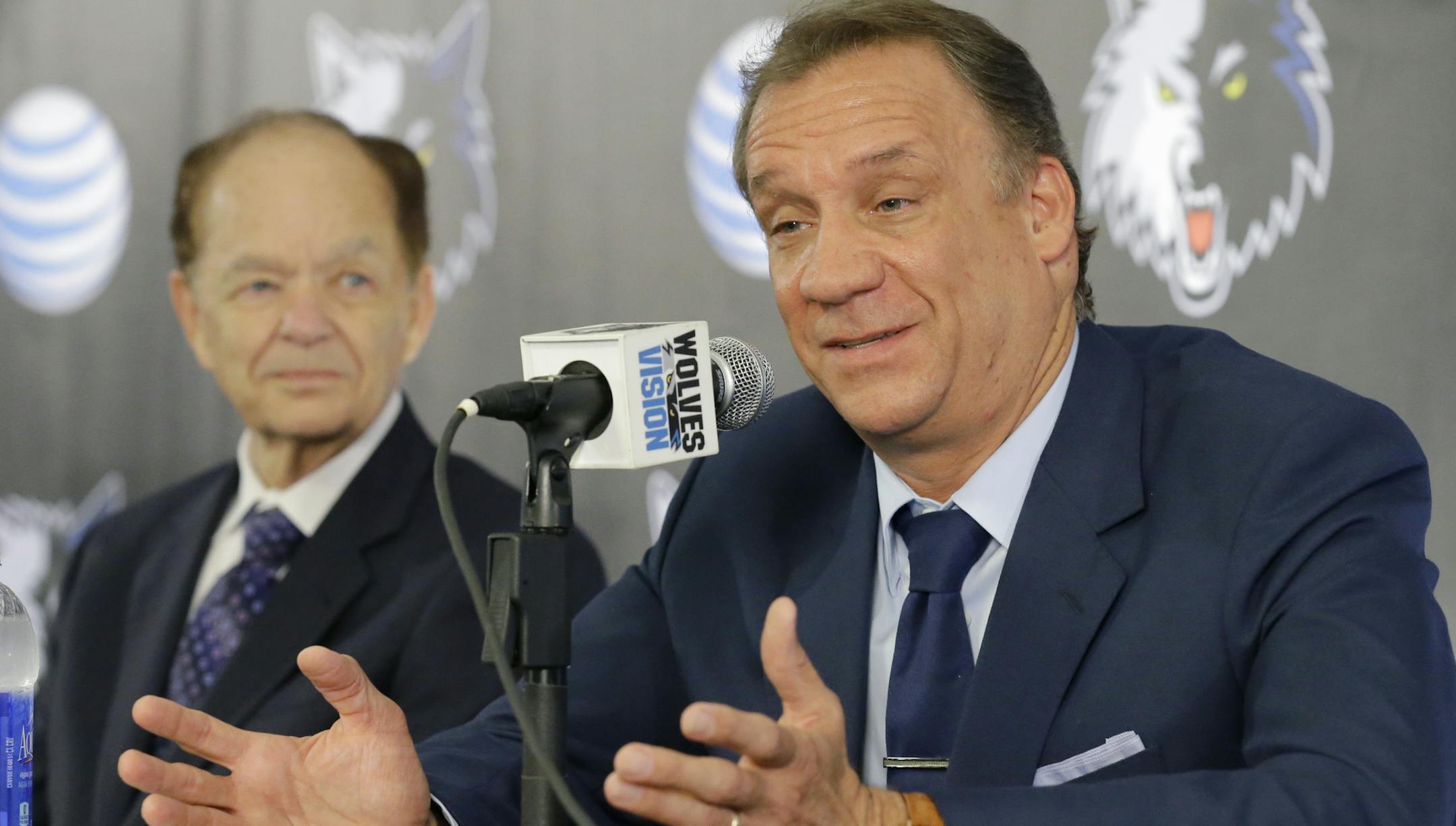 Minnesota Timberwolves team president of basketball operations and new head coach Flip Saunders, right, responds to a question as team owner Glen Taylor, left, listens during a media availability in Minneapolis, Friday, June 6, 2014. (AP Photo/Ann Heisenfelt)