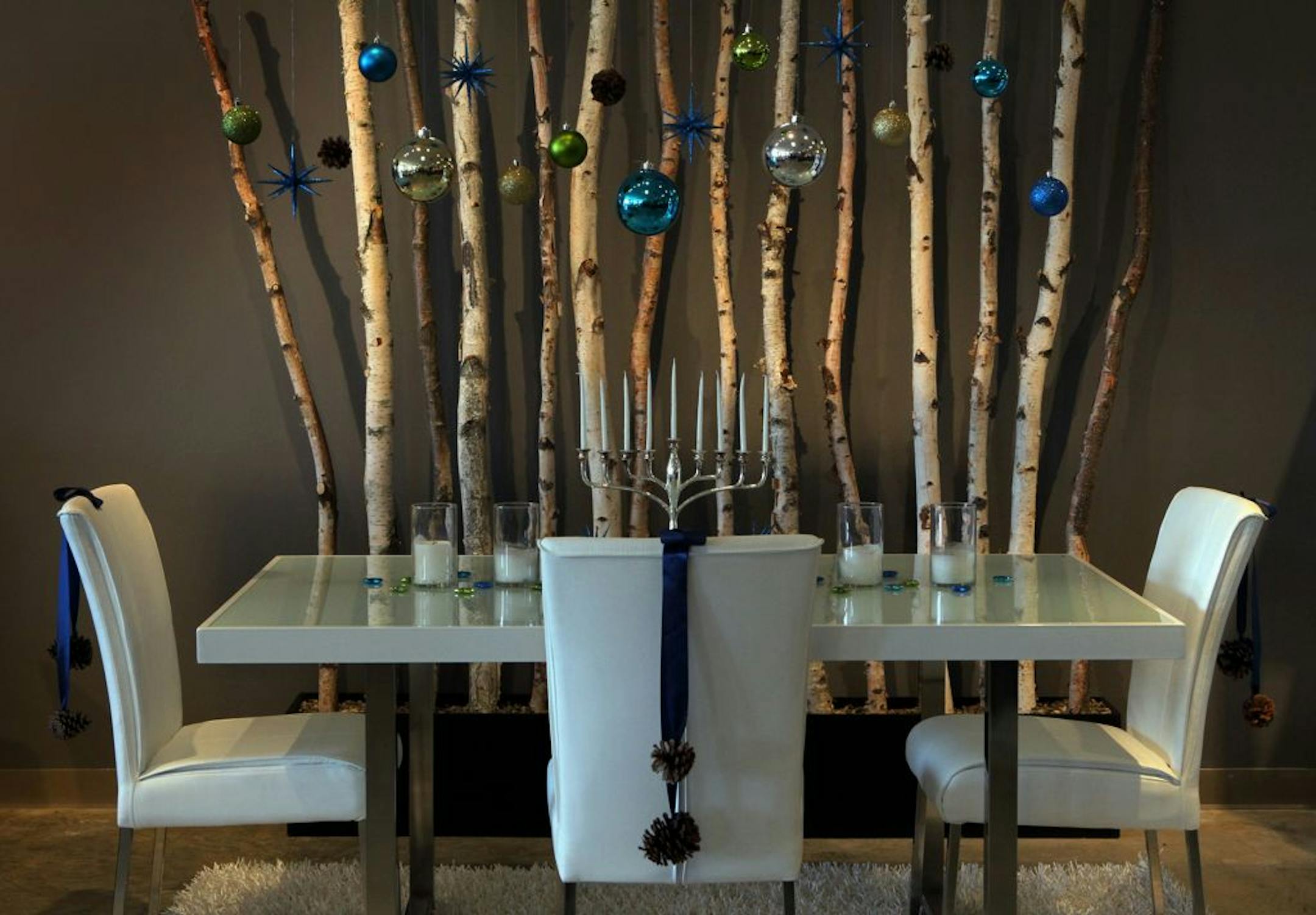 The designers at Ashley Furniture in Ballwin, Missouri set up several holiday decor scenes in their showroom on Manchester Road, November 13, 2012. The Hanukkah candles are the centerpiece of this dining room set up.